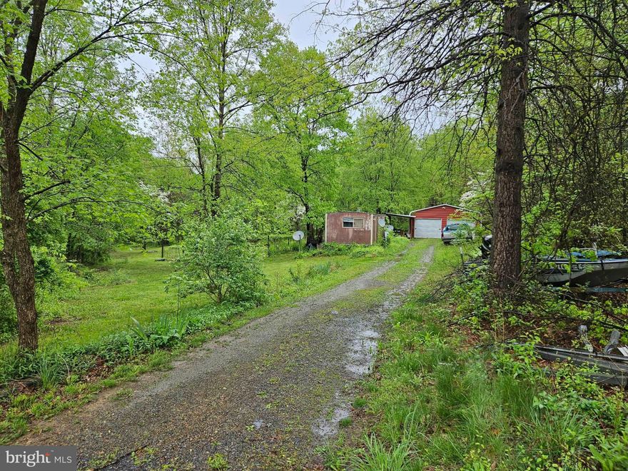 If you are looking for that perfect weekend getaway spot, look no further than 46 Conaway Ln in Great Cacapon. This property is perfect for a weekend home, full time home, any time home! Seclusion at its best, with proximity to everything Berkeley Springs has to offer. Don't miss your chance to own your future piece of serenity
