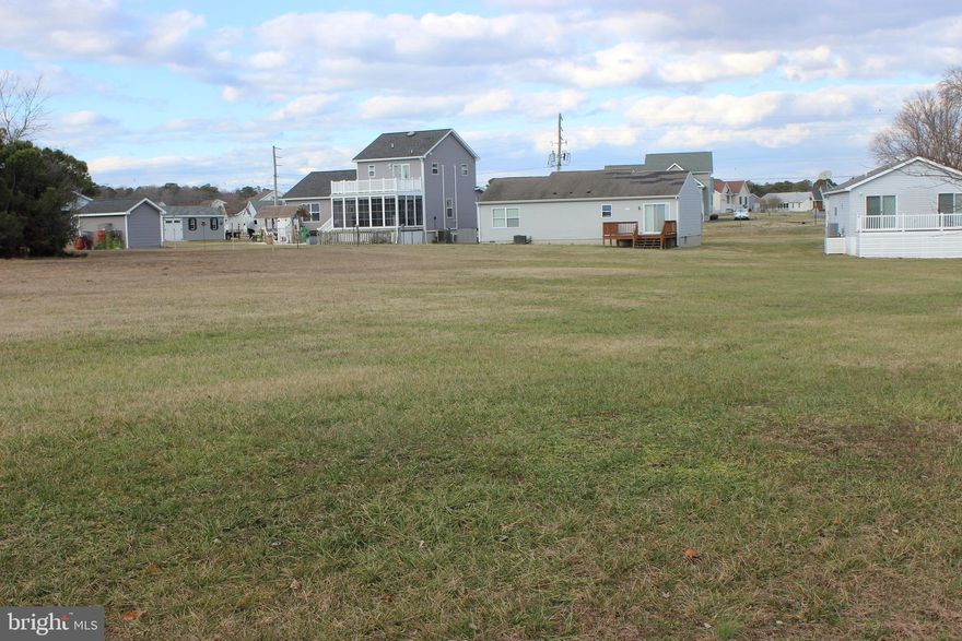 3/1611 Level, cleared, oversized (11,018 sq ft.,) lot located in Captains Cove that backs to a common area with the possibility of water views from a two story home. 3 BR Cert Letter & Wetland Determination on File. Close to the amenities offered at Captains Cove. Buy now and build later, take advantage of this great buy! No time frame to build and no builder tie-in. Call for builder information. Relax and enjoy all the amenities and the lifestyle on the Eastern Shore of VA. Captains Cove is the Eastern Shore of Virginias fastest growing Golf & Waterfront community; close to Chincoteague Island, Wallops Island and Ocean City MD. HOA amenities: 9 Hole Pristine Golf Course, indoor/outdoor pools (2), fitness center, basketball & pickle ball courts, boat ramp, docks, playground, biking & walking trails, dog park, security and so much more.