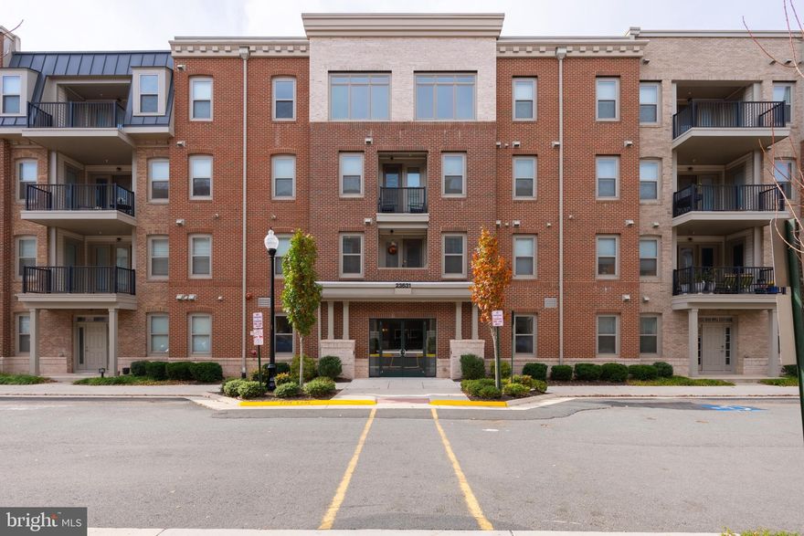 Imagine coming home to this amazing 55+ ACTIVE ADULT COMMUNITY in Birchwood at Brambleton.  Enjoy the amenity rich community including Indoor & Outdoor Pools, Demonstration Kitchen, Indoor & Outdoor Bars, Theatre & Game Rooms, Health & Wellness Center, Art Studio, Golf Simulator, Social Gathering Spaces, Pickleball & Bocce Courts, Greenhouse & Garden Area, and Fishing Pier With Catch And Release Fishing.  Spend time with your friends and neighbors taking in the sights and sounds of nature,  enjoying community activities, taking a stroll around the lake, or taking part in the many clubs at the Birchwood.
<br>
This secure condo building has a dedicated community room, a stunning lobby that will impress the pickiest of clients with a beautiful sitting area, and a pet station.  You will be the envy of your friends and neighbors with not only this immaculate, modern, and sleek condo that was the former model home, but also the over 50k in designer features and upgrades.  Whip up your favorite meals with style and sophistication in your gourmet kitchen with a farmhouse sink, modern faucet, Level 7 cabinets, 'over' AND 'under' cabinet lighting, and granite counters.  The kitchen island is the perfect spot for a quick snack and overlooks the family room for easy entertaining!  Enjoy time in your living area or step outside onto the large private balcony for your morning coffee or just to get some fresh air.  Head over to your spacious primary suite with a sitting area, large walk-in custom built-in closet, and designer window treatments.  The luxury primary bath offers separate vanities, a walk-in shower, upgraded tile to the ceiling, and a linen closet.  Head over to the second bedroom and bath where the luxury and upgrades continue.  A spacious laundry room with shelving conveniently located just off foyer. This condo comes with 2 dedicated parking spaces.  Come take a look-you'll love all the beautiful upgrades!