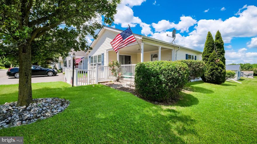Welcome to the Village of Neshaminy Falls!  Wonderful curb appeal with manicured gardens and fencing. This well maintained 2003 home offers over 1,350 square feet of comfortable living space with 2 bedrooms and 2 full bathrooms.  Great open layout featuring a spacious living room and dining room open to the kitchen with extended countertops.   Enjoy relaxing on the front porch or in the bright sunroom/den featuring a slider leading to a porch. Conveniently located within walking distance to the new clubhouse and community pool. Additional features include a shed for extra storage. Major updates include a roof installed in June 2021, carpeting installed in June 2022 (excluding bedrooms), and a new a/c-heat pump unit installed in August 2025, The monthly ground rent includes clubhouse, pool, community room and sewer. The community room is beautiful and features a library, fitness room, game room and so much more. Many activities/clubs offered along with weekly shuttle to area markets, Fabulous community and a wonderful place to call home!
