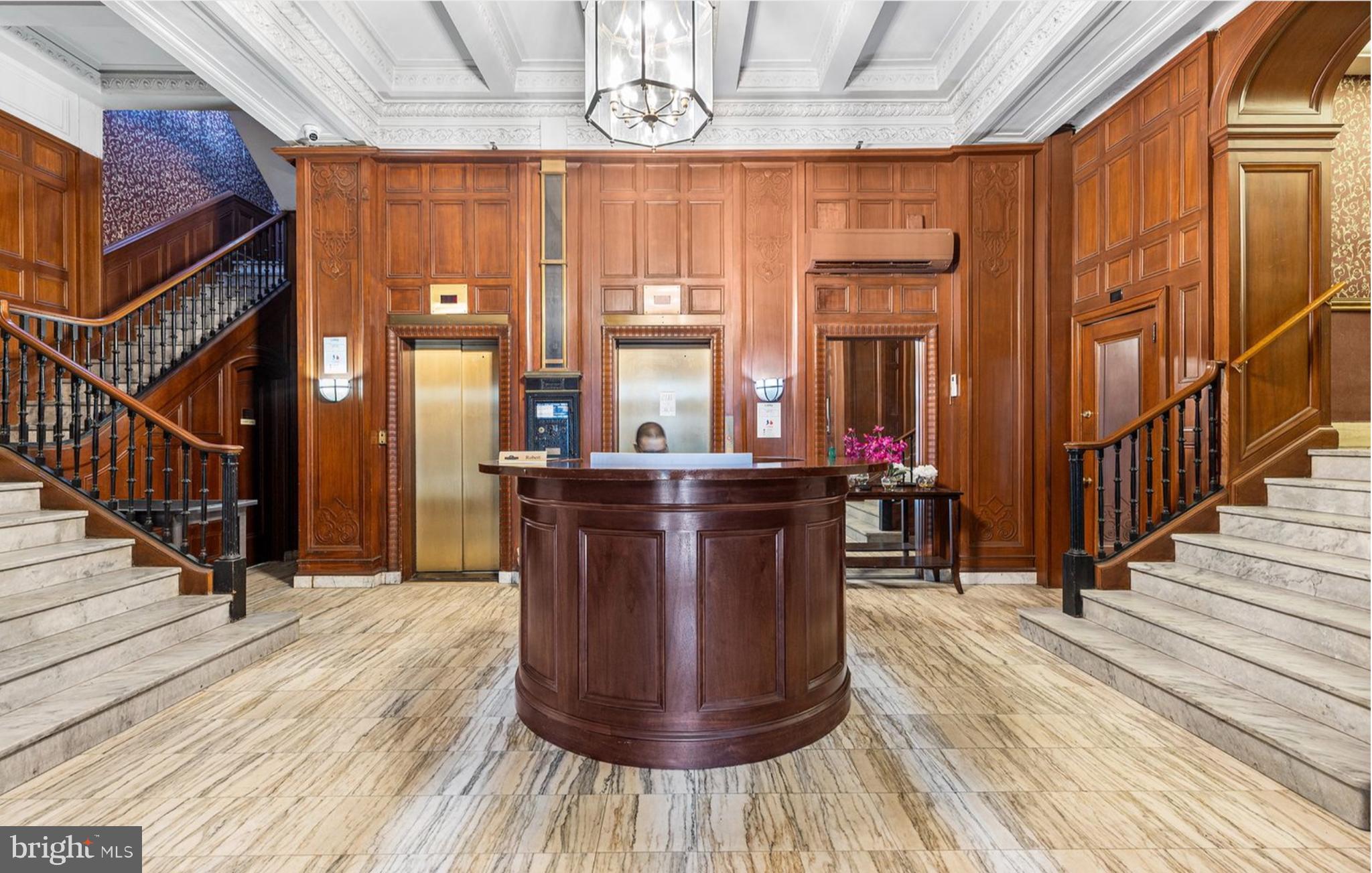 This beautifully renovated corner unit on the 12th floor at the Lenox Condominium offers an exceptional living experience. One of the few units with split system central A/C—an impressive and rare upgrade—this home combines modern comfort with classic charm. The spacious, open-concept kitchen has been fully renovated and features sleek custom cabinetry, stainless steel appliances, and elegant quartz countertops, making it a true highlight of the home. Parking is a breeze with a deeded, gated on-site parking space available and included with the sale behind the building (space G1 - please note to include separate tax ID when submitting your offer).
Large double-pane windows throughout allow natural light to pour into the rooms while offering stunning views of the city. The living room boasts tall ceilings (at least 10') and expansive southern and western views, creating an airy and bright atmosphere. It is further enhanced by an original decorative mantle and a bay window. The generously sized bedroom features a walk-in closet, ceiling fan, and both northern and western exposures. A modernized bathroom and plenty of closet space complete this beautiful home.
The Lenox Condominium is a landmark building designed by renowned New York architects Clinton and Russell, originally built in 1920 and converted into condominiums in 2004-2005. It boasts high ceilings, large rooms, and an abundance of natural light, maintaining many of its original architectural elements. The building offers 24/7 doorman service and is ideally located at the southern end of Mid-town Village in Washington Square West. You’ll be just two blocks from the vibrant shops, restaurants, theaters, and nightlife of Midtown Village, Walnut Street, and the Avenue of the Arts, as well as a short walk from Thomas Jefferson and Pennsylvania Hospitals.
The condo fees cover heat, hot water, high-speed internet, and door staff. Residents are responsible for their own electricity and cable TV. There’s also the potential for additional storage available for a small fee, and the building is pet-friendly. For those seeking fitness options, gyms are located within a few blocks. Public transportation options are plentiful.