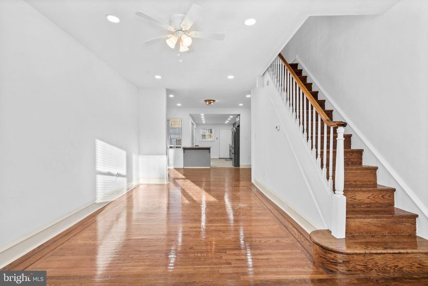 Welcome to 3261 N Etting Street — a fully renovated 3-bedroom, 1.5-bath townhome in Philadelphia's Allegheny West neighborhood, just minutes from East Falls, Kelly Drive, and the Dell Music Center.

Step inside to a bright, open living and dining area featuring gleaming hardwood floors, recessed lighting, and a classic staircase with turned balusters. The layout flows seamlessly into a brand new kitchen designed to impress - gray shaker cabinets, granite countertops, stainless steel appliances including a gas range, built-in microwave, dishwasher, and French door refrigerator, plus a peninsula breakfast bar perfect for entertaining.

Upstairs you'll find three generously sized bedrooms, each with hardwood floors and ceiling fans. The full bath has been completely renovated with floor-to-ceiling marble-look tile, a quartz vanity, and recessed lighting.
The finished lower level is a true bonus, a large open rec space with tile flooring and recessed lighting, a kitchenette, stacked washer/dryer, and a convenient half bath. Whether you need a home office, gym, guest suite, or additional living space, the lower level delivers.

All appliances convey. Move-in ready — nothing to do but unpack.