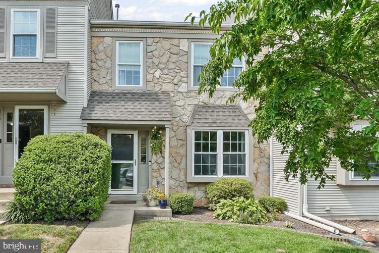Set in the heart of Longwood Crossing, within the award-winning Kennett Consolidated School District, this inviting 2-bedroom, 1.5-bath townhome is move-in ready. Nestled in a quiet row, it offers both comfort and convenience minutes from the best of everything Kennett Square. Step inside to a spacious, open-concept living and dining area — perfect for creating defined zones with rugs, lighting, and furniture layouts that reflect your style. Just beyond the fully remodeled powder room (2019), a sunny eat-in kitchen awaits. The fully renovated kitchen (2022) includes new cabinetry, stainless appliances, quartz counters, backsplash, and flooring. From the kitchen, sliding doors lead to a professionally refinished deck (2024) with tranquil wooded views — ideal for entertaining, relaxing, or quick access to the popular community walking trail. Upstairs, two generously sized bedrooms function like dual primary suites, each offering ample closet space and sharing a spacious updated Jack and Jill bathroom with dual sinks. The full basement provides excellent storage and the potential for added living space. With an open floor plan, lots of updates , and neutral tones throughout, this home is truly turnkey. Minutes from West Chester and Wilmington. Don't miss your chance — schedule your tour today and enjoy the rest of summer in your new home!