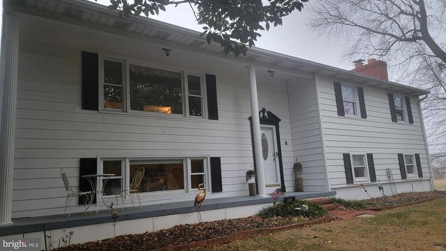 Welcome to 4180 Carvel Lane, a beautifully remodeled split-foyer home in the sought-after Saunders Point neighborhood of Edgewater. Situated just one street from the bay, this waterview property has the wonderful feel of home.

The main level features a spacious, eat-in kitchen with ample counter space, stainless steel appliances, and direct access to the rear deck, making it an ideal space for cooking and entertaining. Original hardwood floors flow up the stairs and down the hall on the upper level, where you'll find three bedrooms, including a primary suite with an attached bathroom, along with a second full bathroom in the hallway.

The lower level offers additional living space with a fourth bedroom, a half bath, and access to the attached one-car garage. Outside, the large, fenced lot provides plenty of room to enjoy the outdoors, and the county has indicated that the property may be subdividable—interested buyers should confirm directly with them. 

This estate sale home has been meticulously maintained by its long-time owner and is being sold as-is, though it remains in excellent condition. Don’t miss the opportunity to own a home in this peaceful waterfront community with easy access to the Chesapeake Bay.