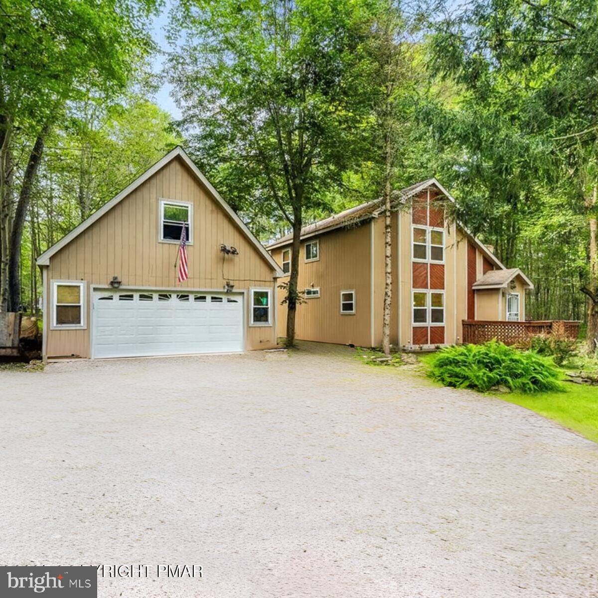 This spacious contemporary sits on a double lot totaling just over half an acre in the desirable Arrowhead Lakes Community. Offering 3 generously sized bedrooms, 2 full bathrooms (including a soaking tub), and a large deck perfect for entertaining, this home provides plenty of space for family and friends. Public Water, you can add additional rooms without the worry of the septic size. The oversized 2-car garage includes a very large, unfinished room above—ideal for converting into a game room, playroom, or ultimate man cave—plus ample storage for vehicles and recreational toys. Inside, you'll find a cozy family room with a fireplace and comfortable furnishings—all included in the sale—so you can start enjoying your new Pocono home right away. Arrowhead Lakes offers two large lakes, sandy beaches, heated outdoor pools, tennis and basketball courts, playgrounds, a clubhouse with community events, and year-round activities—making it perfect for a primary residence, vacation home, or short-term rental investment. Furniture included in the sale. Enjoy privacy, space, and endless amenities in this sought-after Pocono community!
