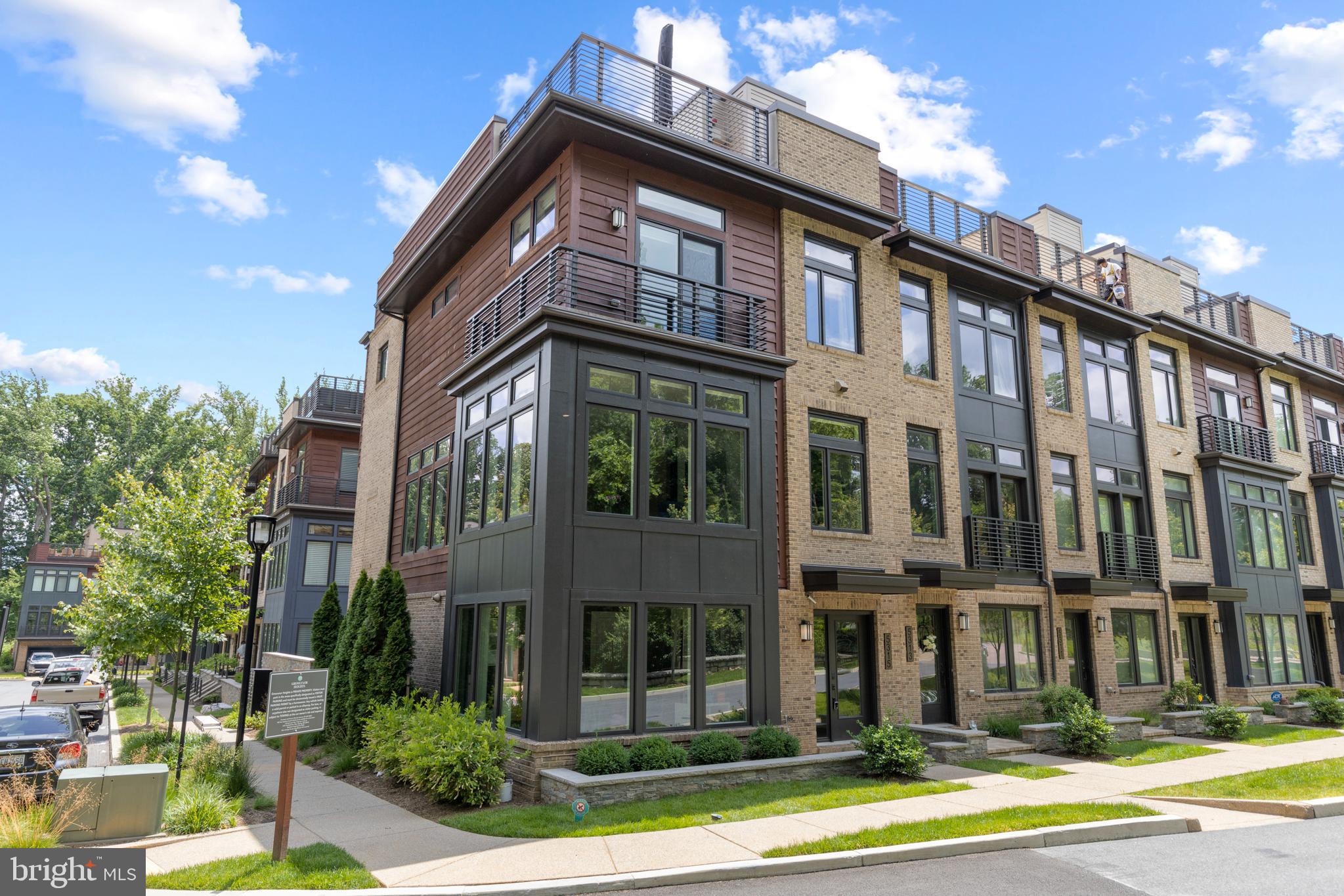 Click the Virtual Tour link to view the 3D walkthrough. Luxurious townhouse living in Grosvenor Heights! Conveniently close to Metro, Wildwood Shopping Center, all of the downtown Bethesda shops & restaurants, DC, and more. This end-unit home boasts 4 beds, 3.1 baths, and an attached 2-car garage on lower level. An incredible smart home system is included that controls the blinds, sound, televisions and lights. Everything conveys! Hardwood flooring throughout. Enjoy multiple living spaces on all three levels as well as a balcony off of the 2nd level and a spacious, private rooftop terrace with a built-in Viking grill, outdoor fireplace, and a wet-bar. Ideal to entertain or watch a movie (outdoor TV conveys). The designer gourmet kitchen is a dream- complete, with Thermador appliances, a kitchen island, granite countertops and recessed lighting. The living room has a lovely gas log fireplace and a hidden bar area with a wine fridge. Floor-to-ceiling windows open the space up and provide tons of natural light throughout and amazing views!! The primary suite boasts 2 separate WIC and ensuite bath with walk-in shower and double vanity. The downstairs office or guestroom also has an ensuite bathroom as well.