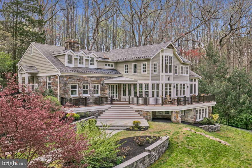 Welcome to 910 Peacock Station, where luxury living meets natural splendor in a breathtaking property unlike any other in McLean. This remarkable estate boasts a fully renovated home and a detached garage, both embraced by a serene, private yard overlooking the tranquil waters of a stocked pond that backs onto Fairfax County Parkland. The main floor, adorned with a formal living room and family room, each features a stone fireplace, seamlessly blending elegance with comfort. The gourmet kitchen, opening to the family room and dining room, showcases spectacular views of the pond, while doors lead to a wrap-around deck with views of the natural splendor, inviting you to embrace outdoor living at its finest. A screened-in porch off the family room offers additional allure, perfect for enjoying quiet moments by the water. For those in need of a dedicated workspace, the main level also includes an office with built-ins or a playroom/den. Additionally, the main level hosts a conveniently located powder room and laundry room. Upstairs, three bedrooms await, including a luxurious owner’s suite complete with walk-in closets, an opulent bath, and an office with built-ins overlooking beautiful views of the pond. The upper level also boasts a quaint reading nook and a versatile playroom/sitting area. Descending to the lower level, you'll find an additional bedroom, as well as an office with built-ins, each offering unique views of the spectacular property and private pond. The three-car detached garage hosts additional living space, with two large rooms featuring cathedral ceilings, a kitchenette, and a full bath. The expansive yard backs onto Fairfax County Parkland and has access to the Cross Country Trail which leads to Great Falls Park and the Potomac River. Nestled at the end of a long driveway, this property is a commuter's dream, with easy access to the beltway, Metro, DC, Tysons, and just 5 miles from the heart of McLean. Don't miss the chance to make this exquisite property your own, where luxury, comfort, and convenience converge to create the ultimate dream home experience. Experience serenity and sophistication in your own private sanctuary at 910 Peacock Station.