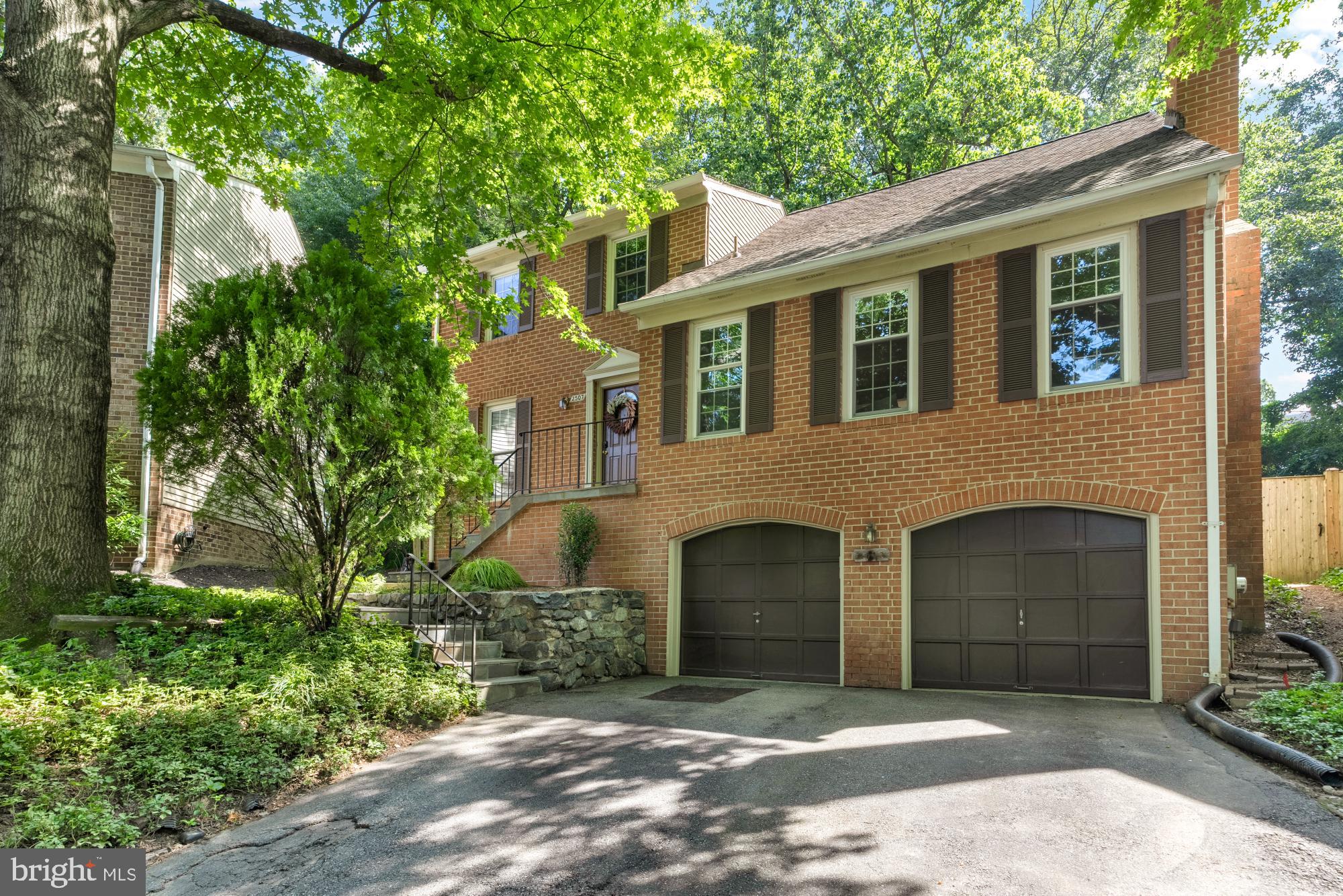 Located in a quiet cul-de-sac of Kensington's desirable Rock Creek Hills, this charming three-bedroom home blends modern amenities with cozy charm. The hardwood floors lead to a spacious family room and dining area, centered around a chef's kitchen with stainless steel appliances, white shaker cabinets, and granite countertops. The eat-in kitchen opens to a deck with a serene backyard view, while an adjacent dining room is perfect for formal meals.
The main level includes a spacious living room featuring a brick wood-burning fireplace and a convenient half bath. Upstairs, you'll discover a spacious primary bedroom featuring a luxurious en suite bath, designed to provide a private retreat. Two additional bedrooms, each bathed in natural light and designed for ultimate relaxation, complete the upper level. The updated bathrooms are crafted with a focus on luxury, featuring modern fixtures.
The lower level presents a versatile recreation room, an additional full bath, and a functional laundry area with direct access to the attached two-car garage. The home boasts a maintained yard, ideal for outdoor activities or unwinding in tranquility. This home is just steps away from the walking and biking trails in Rock Creek Park, offers easy access to key commuter routes I-495 and is conveniently located to Kensington grocery stores, shopping & restaurants.