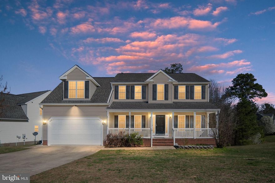 Welcome to this beautifully maintained 5-bedroom, 3.5-bath home perfectly situated on a premium corner lot backing to mature trees/water, offering privacy and exceptional outdoor living. Enjoy the added benefit of high-speed Xfinity internet availability, making working from home, streaming, and everyday connectivity seamless.

From the moment you arrive, you’ll appreciate the home’s inviting curb appeal featuring a large covered front porch, concrete driveway, and attached two-car garage with convenient side entry.

Step inside to a welcoming two-story foyer highlighted by gleaming hardwood floors and elegant architectural details including crown molding, chair rail, and wainscoting throughout the main level. Formal living and dining rooms provide excellent space for entertaining, while the spacious family room offers a warm gathering space with a beautiful stone gas fireplace.

The well-appointed kitchen features stainless steel appliances, gas cooktop, built-in microwave, pantry, and a bright bay window dining area overlooking the backyard.

Upstairs you’ll find four generously sized bedrooms and two full baths, including an impressive primary suite with vaulted ceilings, power shades, a huge walk-in closet, soaking tub, double vanity, and a newly renovated walk-in shower with bench seating. The upper-level laundry room adds everyday convenience right where you need it.

The finished walk-out basement expands the home with approximately 1,200 square feet of additional living space and features crown molding, recessed lighting, full bathroom, legal bedroom, and an additional flex room currently used as a sleeping room along with multiple storage areas and direct walk-out access to the backyard.

Outdoor living truly shines with a massive Trex deck with built-in LED lighting and a 30×12 covered concrete patio with electrical already installed for a future hot tub, creating the perfect space for relaxing or entertaining while enjoying the peaceful wooded backdrop.

Conveniently located just minutes from Interstate 95, Virginia State Route 207, shopping, dining, and Kings Dominion, this home offers an ideal commute to Fredericksburg, Richmond, and Northern Virginia.