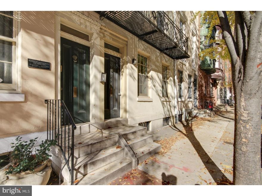 Located in the pristine Rittenhouse Square neighborhood on tree lined streets, this 2 bedroom/2 bath condo offers 1,131+ square feet in a prime location. Away from noise, on the upper floor, enter inside to the foyer and step up to the open-floor layout with kitchen, eating area and living room with a fireplace. Kitchen features a breakfast bar, SS appliances and ample cabinetry. Finished hardwood floors, brick accents around the fireplace and natural light flows in from the large windows, to complete the first floor. Upstairs you will find to generous sized bedrooms. Both bedrooms have two closets to meet all of your storage needs and fireplaces with brick wall accents. The full bathroom, powder room and the W/D complete this home. Amazing spot to enjoy Rittenhouse City living, just blocks from all public transportation and steps from your favorite restaurant, bars, cafes, shops and more!