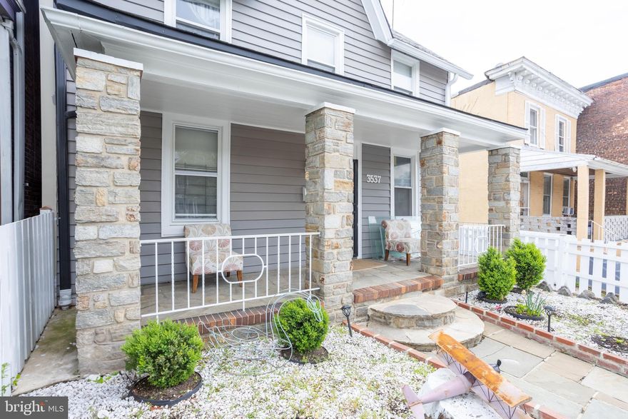 New Price! Welcome to 3537 Greenmount Ave — a spacious, beautifully updated detached home in the heart of Baltimore. Just north of 35th St, this 3BR, 2BA home blends historic charm with modern updates. Features include refinished hardwoods, high ceilings, oversized rooms, and a large country-style kitchen with ceramic tile flooring. Recent upgrades: fully renovated main bath, remodeled primary bath, new siding, stylish fencing, fresh paint, new radiators, restored chimney, and updated flooring. Enjoy a large stone patio, brick storage shed, and fully fenced yard — ideal for entertaining, pets, or play. Covered stone front porch adds curb appeal. Convenient to commuter routes, public transit, parks, and shops. Move-in ready and priced to sell!