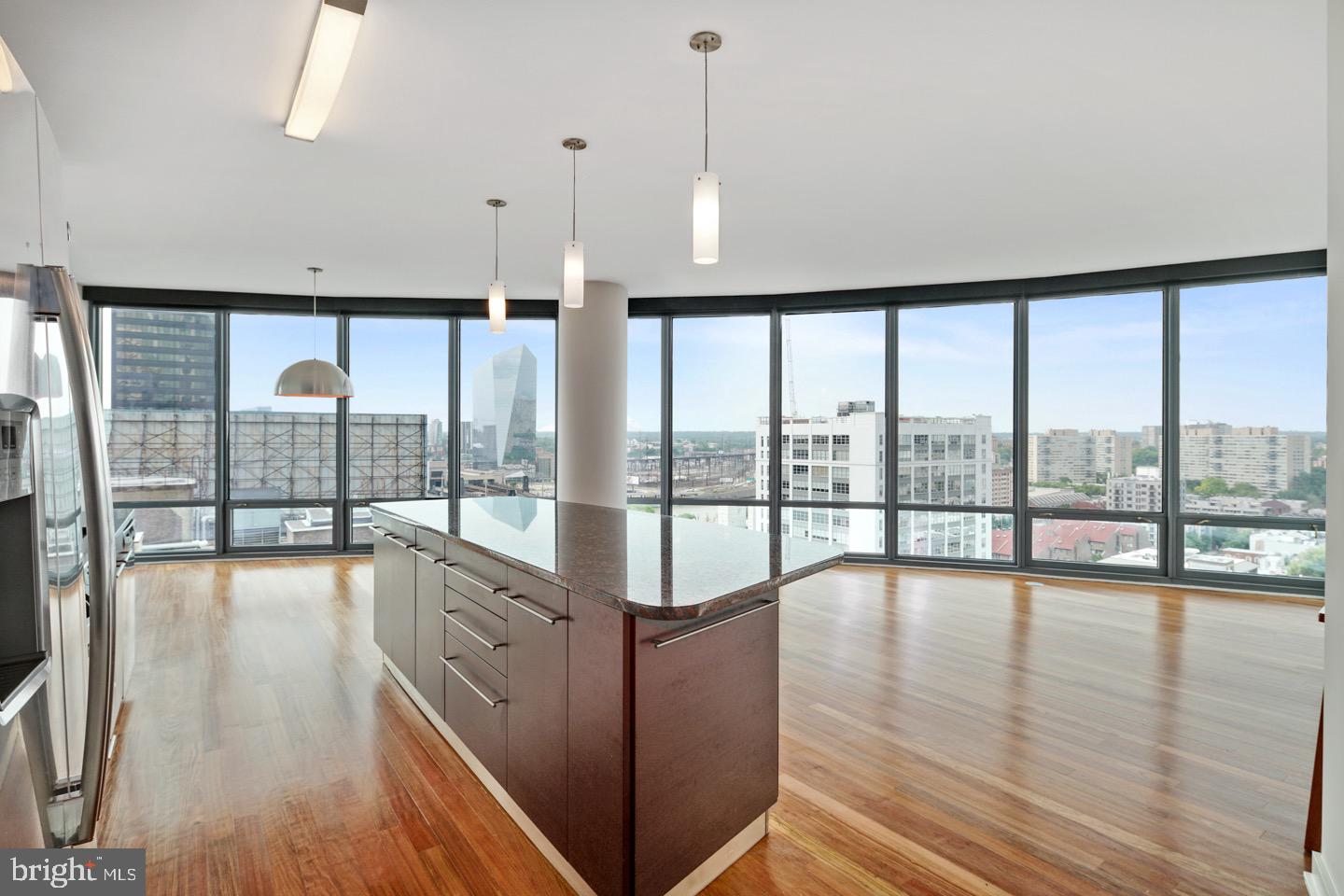 Welcome to Unit 902 at The Murano – a rarely offered curved-glass residence in one of Philadelphia’s most iconic luxury high-rises. This striking 2-bedroom, 2-bath home spans 1,408 square feet and offers dramatic north-facing city views through floor-to-ceiling windows that wrap around the signature curved façade – a truly unique layout not often available on the market.
Step inside to discover a bright, open-concept living and dining space flooded with natural light, perfectly suited for both everyday living and entertaining. The sleek modern kitchen is appointed with stainless steel appliances, granite countertops, and a large breakfast bar. The primary suite features generous closet space and a luxurious en-suite bath with a double vanity, glass-enclosed shower, and soaking tub. A spacious second bedroom and full hall bath complete the layout.
This unit also includes one deeded parking space in the building’s private garage and a secure storage locker – both included in the price.
The Murano offers residents full-service amenities including a 24-hour concierge, indoor heated lap pool, state-of-the-art fitness center, community sun deck, and hospitality suite. Located just steps from Rittenhouse Square, the Schuylkill River Trail, Trader Joe’s, and some of the city’s best dining and shopping, this is luxury city living at its finest.
Don’t miss this rare opportunity to own a curved-glass unit in one of Philadelphia’s premier residential towers.
* please take note that photos are from a same layout unit on a slightly higher floor.*