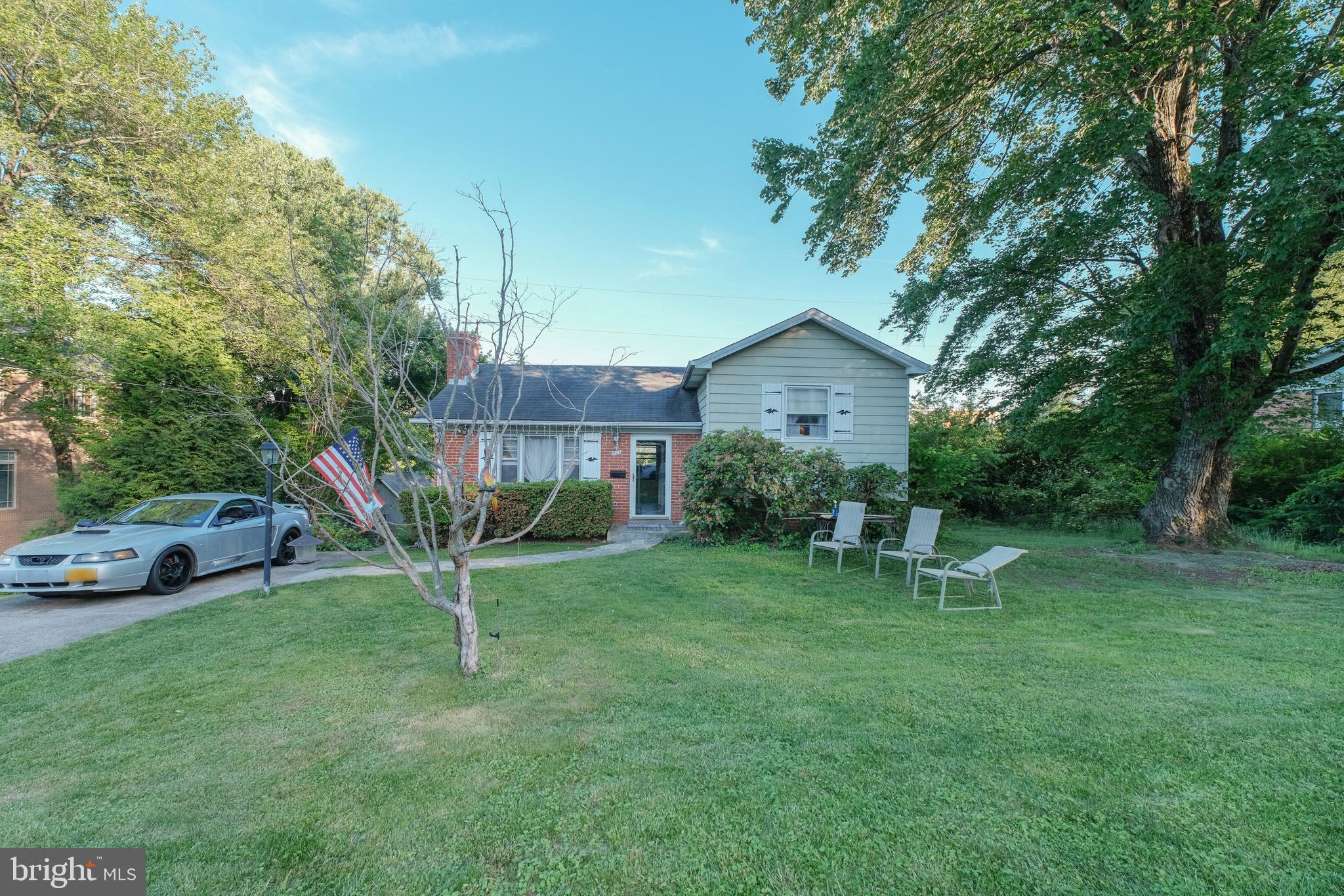 Lovely Classic 4 bedroom/2 bath home in sought after Falls Church. Home boasts gleaming hardwood floors on main level, light filled living and dining room with cozy fireplace, and generous size bedrooms with closet space. Walk out lower level with built-in bookcase, washer-dryer, and great recreation space. Large 1/3 acre lot perfect for entertaining with deck/patio, tons of yard space, and mature trees. McLean high school district. A MUST SEE!