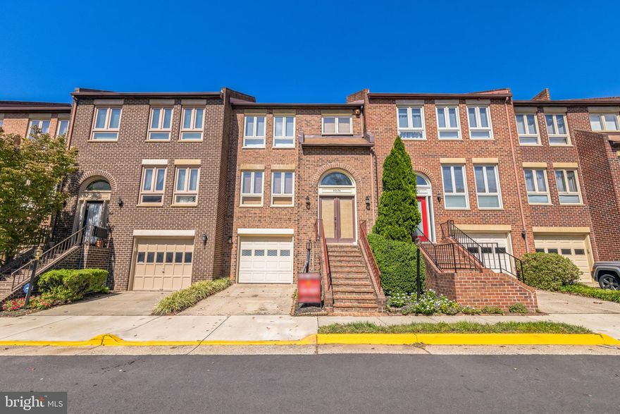 All brick townhome features THREE Bedrooms, TWO Half baths, a GARAGE, PLUS additional parking is available. Hardwood floors throughout the main and upper levels. The light-filled living room conveniently has electronic blinds, as does the primary bedroom. The dining room has chair rail molding and can graciously hold a full-sized table for those family dinners. The kitchen was remodeled in 2017 with granite countertops, tile flooring, new cabinets, accent lighting on dimmers, recessed lighting and a newer microwave and Bosch dishwasher. There is a breakfast eating area adjacent to the kitchen with a fireplace, extra cabinets for storage and additional countertop space. On the upper level is the primary bedroom which is SPACIOUS and has a walk-in closet, and primary bathroom with two vanities. There are two additional bedrooms and a second full bathroom on the upper level. Walk down to the lower level and there is a large family room which can also serve as a grand home office.  The family room features a fireplace and wet bar with sink. There is a second half bath on the lower level, along with a front-loading washer and dryer in the laundry closet, a utility room, and easy access to the garage. From the family room, walk out to a sunny, all brick, rear patio that is fenced-in for privacy.  With nearby shopping, the Borge Street Park, a commuter bus stop just outside the neighborhood, the Vienna Metro only 1.7 miles away, and easy access to I-66, this is an unbeatable location! Oakton HS Pyramid.