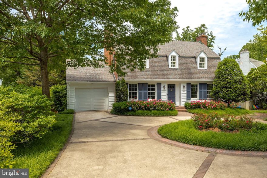 6422 Western Avenue is a home unlike any other. The specific location of the house straddles the border between Maryland and Washington, DC. As you pull in off Western Avenue into the circular driveway, with professional landscaping boasting mature plants offering privacy from the street, is the original DC boundary stone marker which is one of the first national monuments in history – George Washington even touched it himself! This home is unusually rare, not only for the location’s historic significance, but this property sits on a pristine 18,600 square foot lot with beautifully maintained professional landscaping.

MAIN LEVEL:
This five-bedroom, four-and-a-half-bathroom home boasts unique details and thoughtful designs throughout all three levels. 6422 Western Avenue presents a traditional floor plan with the spacious foyer directly in the middle of the main level of the home. To the right is the formal living room featuring gleaming hardwood floors, crown molding, recessed lighting, built-ins, and a wood burning fireplace. Just beyond the formal living room is the formal dining room with an alcove of curved windows aligning the northwest wall and access to the expansive, wrap-around rear deck. The kitchen is off the dining room and is fully equipped with custom stone counters, a peninsula with counter seating, ample cabinet space, professional stainless steel appliances, a double oven with a hood, a French door fridge, and access to the side of the rear deck. The open-concept kitchen flows into the family room with a gas fireplace and access to the garage.

UPPER LEVEL:
The upper level of the home holds four of the bedrooms. The two bedrooms on either side of the staircase face towards the front yard and both are equally spacious with large closets and en-suite bathrooms. The owner’s bedroom faces the backyard with stunning garden views and features ample closet space and a luxury en-suite bathroom with a double vanity and a soaking tub.

LOWER LEVEL/REAR YARD:
The lower level of the home holds the fourth bedroom, the fourth bathroom with a steam shower, and the recreational room offering tremendous flexibility as a playroom, gym, studio, family room, you name it. This level also offers the indoor pool with windows surrounding the space making it feel like you are outside when actually enjoying a swim indoors. Access to the backyard is also available on this level. Outside, in the fenced-in, private backyard, you will find a large patio area and a pathway into the rear garden – a true oasis. The garden has different paths to take to explore and admire the greenery and guides you towards the saltwater outdoor pool. You can have it all with this house where everything has been thought of! Don’t miss your chance to call this beautiful house in a wonderful neighborhood your new home!