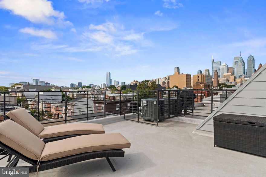 Your Morning Coffee Just Got a Million-Dollar View! Picture this: You're sipping coffee on your private rooftop while the Philadelphia skyline stretches endlessly before you. No shared deck. No blocked sightlines. Just you, the city, and those unfiltered moments that make Philly living extraordinary.
Why Graduate Hospital? Because You Get It All!
Forget choosing between convenience and character. This neighborhood delivers both with zero compromise. The subway, buses, Sprouts, Giant, and Target are just one block away.  And the Wonder Food Hall just opened down the street!
When you step inside the bi-level unit, you'll notice the beautiful kitchen that flows into the living space. Quartz countertops handle everything from meal prep to laptop sessions. The home has gorgeous hardwood floors throughout. The main living area floor is completed with a powder room.
Your main bathroom features double sinks because sharing a mirror shouldn't require negotiation. The walk-in closet in the primary bedroom means you'll have plenty of storage space for all your clothes and more!  In-unit laundry means no more Sunday evening trips to the basement!
And that wet bar with wine fridge? It's positioned perfectly on your way out to the private roof deck.
And the best part, there are 6 years left on the original Philly tax abatement!! And when friends ask where you live, you'll give directions to "the place with the killer roof deck" – because that's how people will remember it.
Some condos give you shelter. This one gives you stories worth telling.