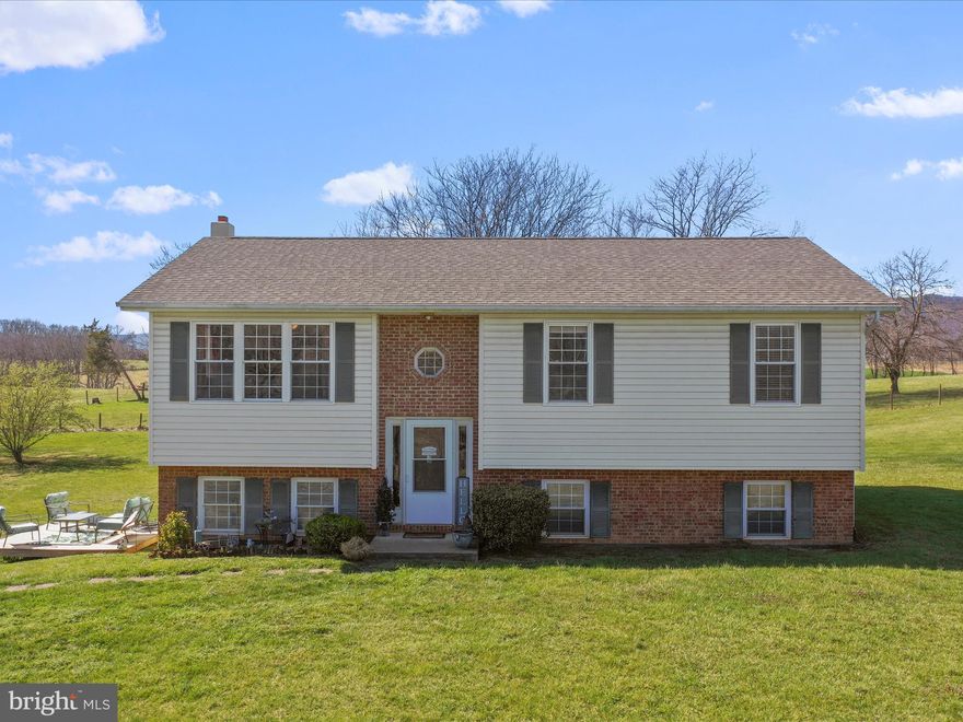 Welcome home to 2715 Swartz Rd. in Woodstock, VA! This charming 3-bedroom, 2-bathroom split-level home offers the perfect blend of privacy and convenience, nestled in a peaceful country setting while remaining close to local amenities. Inside, you'll find a spacious living room, an inviting eat-in kitchen featuring stainless steel appliances, and a separate dining area. The primary bedroom boasts an attached full bath, while two additional bedrooms and a second full bath provide extra comfort. The lower level features an unfinished basement, ready for your personal touch to create the space of your dreams.Situated on over 3.5 acres, the property offers plenty of space to enjoy the outdoors. Outside, enjoy a private rear deck overlooking stunning mountain and farm views—perfect for relaxing or entertaining. Don't miss this opportunity—schedule your showing today!