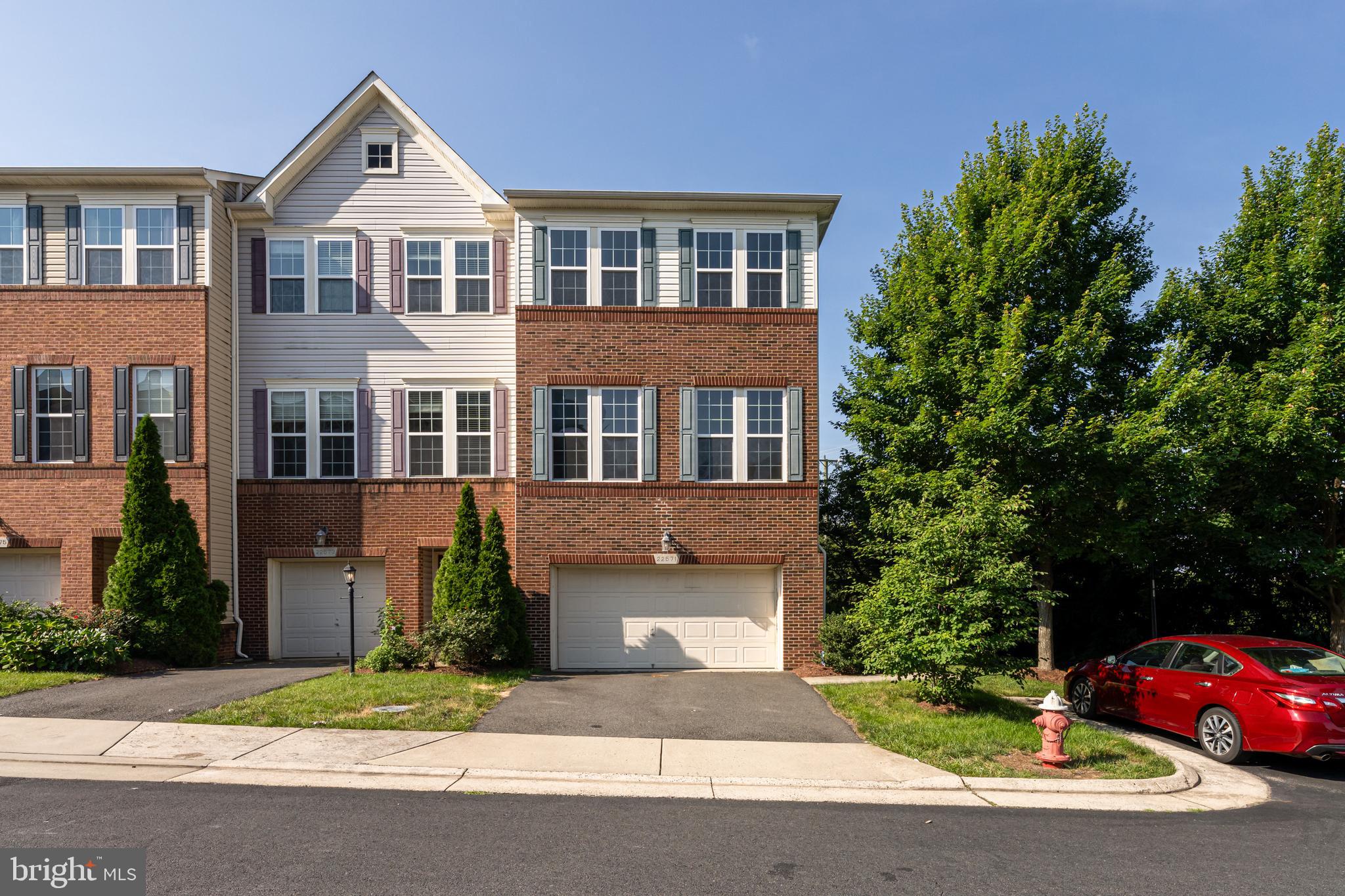 Welcome to 22571 Highcroft Ter a stunning 3-level end-unit townhouse in the heart of Ashburn, VA, offering 4 bedrooms, 3.5 bathrooms, and over 2,200 sq. ft. of thoughtfully designed living space.
Upon entry, you're greeted by a bright foyer, a convenient coat closet, and a versatile first-floor suite featuring a full bedroom, full bathroom, cozy fireplace, and a walk-out to the backyard perfect as a guest suite, home office, or recreational space.
The main level showcases an expansive living room flooded with natural light thanks to numerous large windows. Just off the living area is a beautifully appointed kitchen with ample cabinetry, counter space, and room for a full dining setup. Step out onto the private patio for a perfect morning coffee or evening unwind.
Upstairs, you'll find three generously sized bedrooms, including a spacious primary suite, two full bathrooms, and a conveniently located laundry room.
Additional highlights include an attached garage with two parking spots, a 2-car driveway, and abundant guest parking just steps away. Situated in a highly strategic location, this home offers easy access to shopping centers, dining, parks, schools, and all daily essentials.