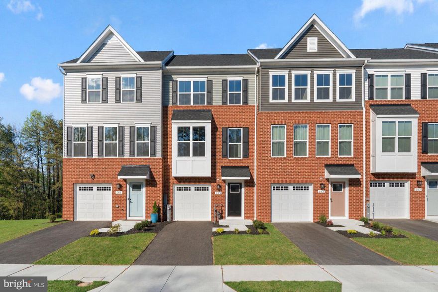 Welcome to The Highlands. This brand-new construction townhome has never been lived in and offers modern finishes with thoughtfully designed living spaces. Enjoy luxury vinyl plank flooring on every level—no carpet! The fully finished entry level features a one-car garage and a versatile recreation room, perfect for a home office, gym, or additional living space. The main level boasts a bright and open floor plan with a spacious family room and dining area that flows seamlessly into the upgraded kitchen, complete with a large island. A convenient half bath is also located on this level. Step outside onto the deck overlooking the backyard and wooded area, creating a peaceful setting to relax. Upstairs, you’ll find three generously sized bedrooms and two full bathrooms, including a comfortable primary suite designed for everyday retreat. Enjoy the convenience of community amenities just steps away, including an outdoor pool and playground. Perfect for the warmer months ahead. Ideally situated with easy access to Route 10, Route 100, and I-97, offering a convenient commute to Baltimore, Annapolis, D.C., and Fort Meade. Outdoor enthusiasts will love nearby Kinder Farm Park, Lake Waterford Park, and the scenic B&A Trail for biking and recreation. Shopping, dining, and daily essentials are all within close reach. Builder warranties included. Mortgage savings may be available for buyers of this listing. Don’t miss your opportunity—this one won’t last long!