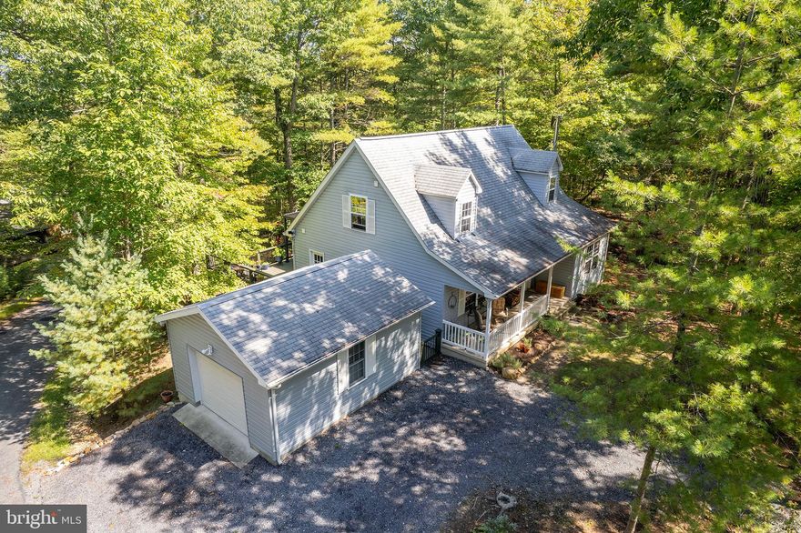 Who doesn't enjoy the comfort of a Cape Cod on a wooded level lot in Bryce Resort adorned with stylish interiors and wait till you sit in the sunroom!  Owners take pride in keeping their home pristine and you will enjoy the bright kitchen with new countertops, family room with wood stove, spacious bedrooms, and primary on the main level.   Enjoy the outdoors on either your front porch or the huge rear deck  with a modern pergola.  Put this on your list to get in before fall ends and be set for ski season for the holidays!