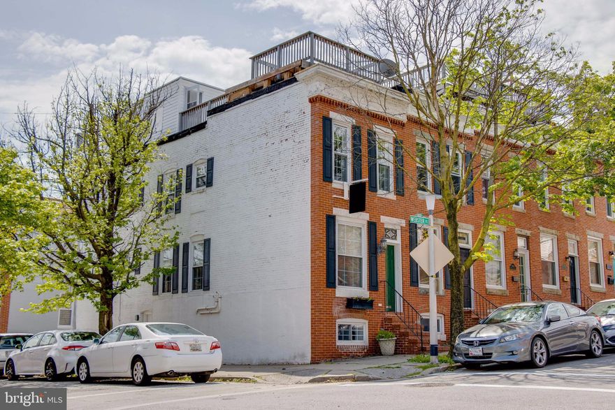 Undoubtedly the best unobstructed views of the Inner Harbor and Baltimore City skyline can be found in this large 4-level end-of-group row home, just 2 blocks from the Inner Harbor promenade.  This value-priced home features 4 bedrooms and 3 full bathrooms that includes a privately accessed above grade lower level - an ideal set up for expense sharing or a guest suite.  Other incredible features include a parking pad designed to accommodate a small car and a 2-tiered roof deck accessed from a shared hallway.  The main level is expansive with a large open living and dining room with hardwood floors and tall ceilings followed by a huge kitchen with stainless appliances and access to the rear parking pad.  There are 2 bedrooms and 2 baths on the second level and a third bedroom with amazing Inner Harbor and Dominos Sugar views.  You won't find more space with parking and roofdeck at this price anywhere downtown.  Convenient access to Key Highway, I-95, Riverside Park, area pubs and restaurants, and the shops of McHenry Row.  This home is vacant and easy and safe to show!