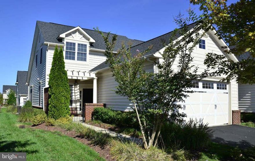 STUNNING PATRIOT II END UNIT IN POTOMAC GREEN*TWO BEDROOM*TWO AND A HALF BATH*INVITING FRONT PATIO*TWO CAR GARAGE*HARDWOODS ON MAIN LEVEL*NEUTRAL THROUGHOUT*OPEN FLOOR PLAN*RELAXING REAR PATIO*TONS OF AMENITIES*