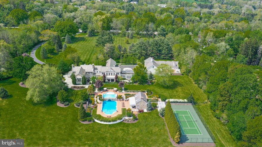 A GOLF CART RIDE AWAY from the world class WEYHILL GOLF COURSE & the SAUCON VALLEY COUNTRY CLUB.  As one would expect of an estate of this caliber, there is a quiet dignity at first approach through the GATED ENTRANCE, down a 700' long winding drive, past specimen plantings and seamless gardens, to the handsome, 1939 STONE home CENTERED AMIDST  22 ACRES. Distinguished, Refined, Established. It is a rare pleasure to encounter such a stunning residence, with timeless appeal