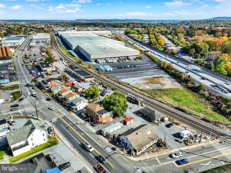 Mixed-Use Industrial • Commercial • Residential | ±3 Acres | Income + Redevelopment Potential

An exceptionally rare mixed-use opportunity in Camp Hill, 302 S 18th Street spans nearly 3 acres and combines industrial, commercial, and residential components—offering both strong existing income and significant redevelopment potential.

The commercial portion of the property is currently used as a construction and masonry supply center, with ample space for material storage, heavy equipment, and contractor operations. Portions of the lot have also been leased in the past for U-Haul truck and trailer rentals, showcasing the site’s versatility and additional income potential.

Property Components Include: