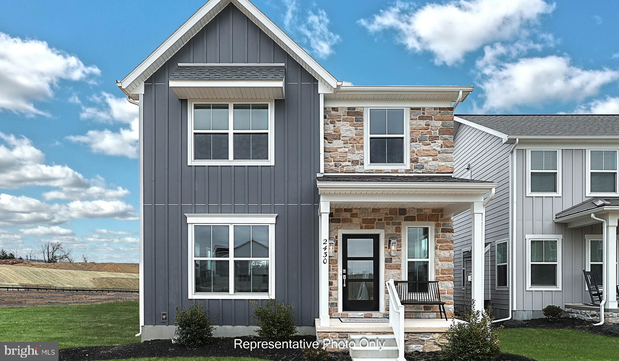 UNDER CONSTRUCTION – AVAILABLE THIS SUMMER: This 2-story home with a sleek profile includes a 1-car, rear load garage with mudroom entry, and a screened-in patio for outdoor living. The first floor boasts 9’ ceilings and stylish vinyl plank flooring. The kitchen, featuring stainless steel appliances, attractive cabinetry, and quartz countertops with a tile backsplash, opens to the spacious dining area and sunny living room with a modern fireplace design as the focal point of the room. The 2nd floor boasts an owner’s suite with an expansive closet and private bathroom, 2 additional bedrooms, a second full bathroom, and a convenient laundry room. (The floor plan shown represents the standard layout for this home plan. Actual layout, features, and options may vary. Construction plans take precedence over artwork. Please see the Community Sales Manager for details.)