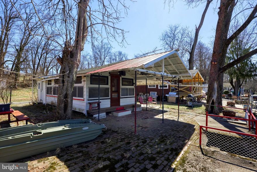 Charming Cottage Retreat on Maiden Creek – A Nature Lover’s Paradise!

Welcome to Slater Grove, a delightful 1-bedroom, 1-bath cottage nestled along the scenic banks of Maiden Creek, a tributary of Lake Ontelaunee. This cozy getaway comfortably sleeps 6-8 guests with air mattresses, and for larger gatherings, you can set up tents in the field across the lane for even more outdoor fun!

Perfect for outdoor enthusiasts, this retreat offers fishing, hiking, biking, kayaking, swimming, and bird-watching. Enjoy the stocked lake for fishing, paddle through the peaceful waters in a kayak or rowboat, or explore the surrounding hiking trails and state gamelands. Across the creek, Willow Glen Playground provides sports facilities, playgrounds, and pavilion rentals for gatherings.

Conveniently located in Berks County, this property is just a short drive from Leesport Farmers Market, the Reading Pagoda, Crystal Cave, and Gring’s Mill Recreation Area. Plus, it's only an hour from Lancaster, Lebanon, Dauphin, Montgomery, and Chester Counties, making it an ideal weekend retreat.

This charming cottage sits in a private grove on leased land, with an annual land lease of $2,200. Prospective buyers must meet with the landowner for approval.

Don’t miss this unique opportunity to own a peaceful escape in Slater Grove!