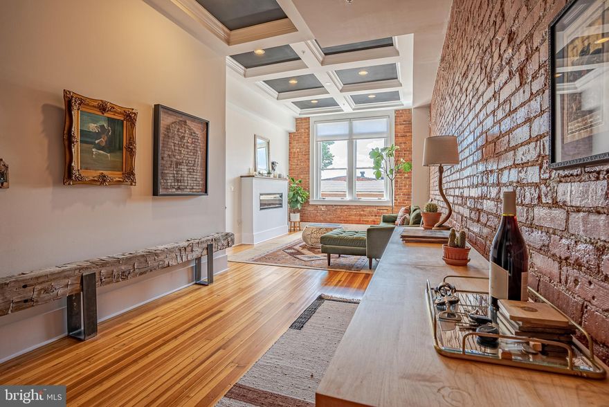 Pythian Castle Circa 1912. Rare opportunity to take part in history & rent in the Pythian Castle. Converted to condos Â & purchased in 2019. This luxury unit has all the modern amenities & is located in the heart of downtown Frederick.Access to the only residential rooftop deck in downtown Frederick with sunset views daily, & stunning views of the mountain range & downtown Frederick. Blocks away from Market Street to enjoy the restaurants, bars, shops, & events Frederick offers. Â Enjoy a walk along Carroll Creek with its goldfish, modern art, sculptures & waterfalls. Baker park is a few blocks away with summer concerts at its "bandshell," fish in culler lake & enjoy the various community events. Take the elevator or stairs to your keyless 2nd floor condo. Your breath will be taken away with the coffered ceilings & hardwood flooring in your living room. Kitchen with custom black cabinets with brushed nickel hardware, ceramic tile backsplash, granite countertops with barstool seating, stainless steel appliances, gas cooking & exposed beam ceiling. Â Family room off kitchen with exposed brick accent wall & fireplace. Master bedroom suite with 15 foot ceilings, tall windows giving lots of natural light & more exposed brick. Master bathroom suite with sit-in oval tub for two, separate shower with subway tile surround & custom glass doors & stylish vanity. The 2nd bedroom is a great size with access to a 2nd full bathroom. Separate laundry room area.