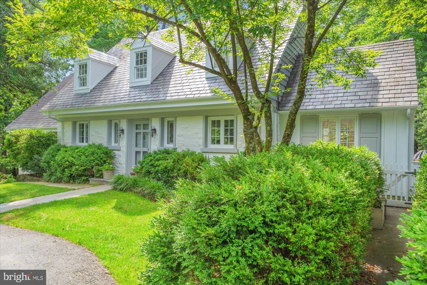 Welcome to this stunning 5-bedroom, 4.5-bath home on a spectacular .45-acre lot in the sought-after enclave of Chevy Chase Hills. This exceptional property with over 4000 sq ft of living space offers a rare combination of timeless elegance, thoughtful renovation, and modern livability—set amid lush, manicured grounds with an in-ground pool, extensive flagstone patios, and a striking serpentine stone wall that extends from front to back.
Recent renovations include a stunning reimagining of the main-level primary suite, now featuring wide-plank wood floors, added windows, and a spa-inspired ensuite bath. A renovated powder room, new appliances and countertops in the eat-in kitchen, updated lighting and hardware throughout, new carpets and stair runners, and new gutters reflect the seller’s meticulous attention to detail. Agents: please inquire for comprehensive list of upgrades.
The gracious main-level floor plan is designed for both everyday comfort and effortless entertaining. The large living room with newly added custom built-ins flows effortlessly between the formal dining room and sunroom which opens directly onto the patio, and a newly constructed IPE deck seamlessly connects the main-level primary suite to the sunroom from the outside—creating a true sense of indoor-outdoor flow. Newly installed HVAC systems now serve both the sunroom and dining room areas, ensuring year-round comfort. French doors from the kitchen open to a private patio—ideal for al fresco dining and entertaining.
Upstairs, the flexible layout offers additional bedrooms with a shared bath, plus a second primary suite with an ensuite bath and a large private sitting room.
The expansive lower level (1208 sq ft) offers impressive functionality and comfort, including a spacious fifth bedroom, full bathroom, and a large recreation room—perfect as a second family room, game room, or home theater. Custom built-ins on this level include an entire wall of sleek base cabinetry, dual built-in refrigerator and freezer drawers for entertaining, and a supplemental freezer in the storage area. A generous laundry room and two storage rooms complete the space, which connects directly to the surrounding patios.
Enjoy a bucolic setting just minutes from the shops and dining of Chevy Chase Lake and future Purple Line Metro access. This is a truly extraordinary offering that combines refined architecture, exceptional flow, and magazine-worthy outdoor living in one of the area’s most desirable neighborhoods.