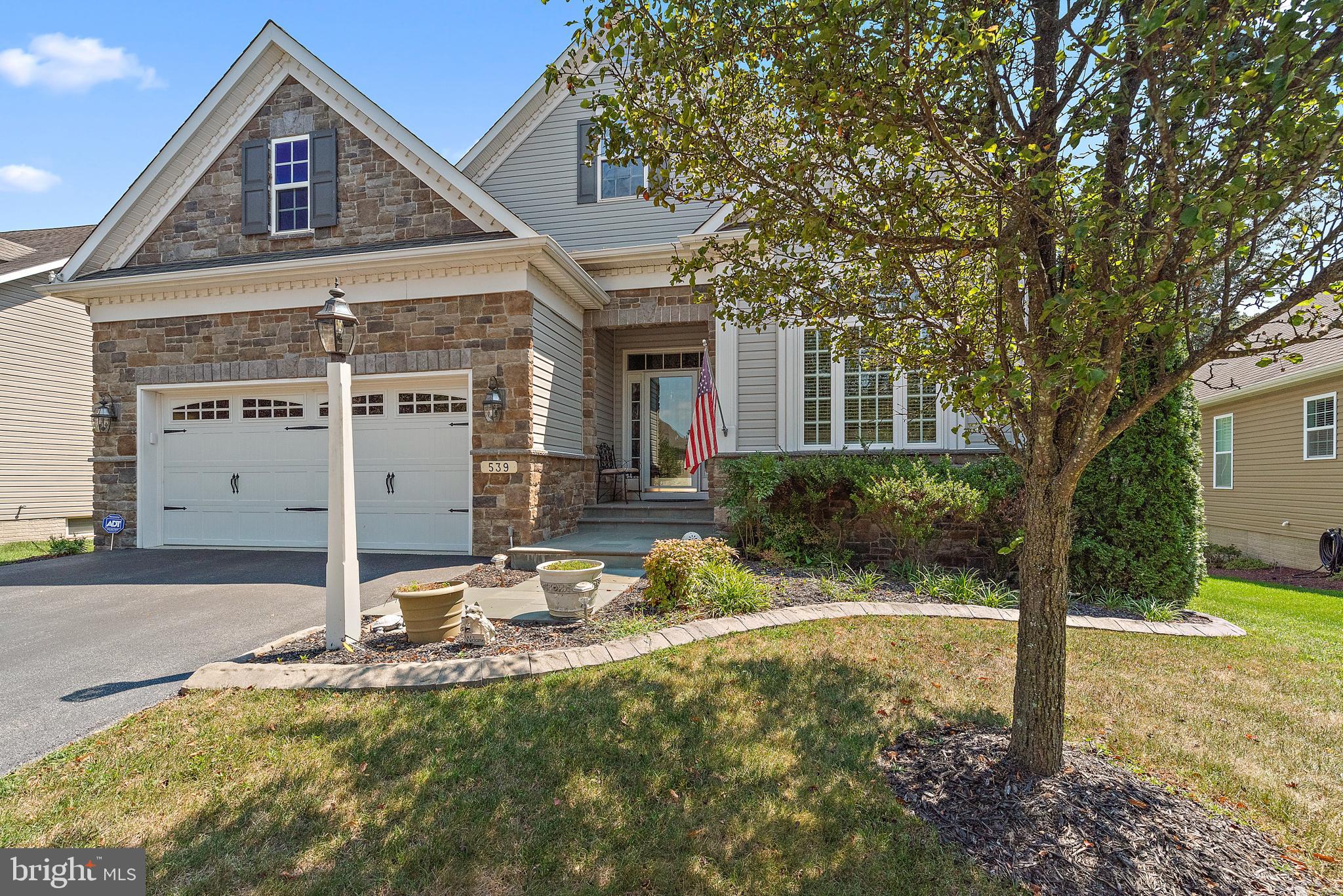 Beautiful Koch-built home in the highly desirable 55+ active adult community of Shipley’s Crossing South! Thoughtfully designed and meticulously maintained, this spacious estate sale offers comfort, functionality, and elegant living across three fully finished levels.
The main-level primary suite provides a peaceful retreat with ample closet space, a soaking tub, and a separate shower. The heart of the home is the gourmet kitchen, designed for the chef at heart, featuring abundant cabinetry, quality appliances, and open sightlines into the expansive living and dining area—ideal for entertaining or everyday enjoyment. A cozy gas fireplace anchors the space, while a flexible front room provides the perfect spot for a sitting area, home office, or hobby space.
Upstairs, a generous loft creates a secondary living space between two well-proportioned bedrooms and a full bath, giving guests or family members their own private level. The completely renovated lower level is an entertainer’s dream—featuring a spacious recreation room, custom bar with kitchenette, full bathroom, and two large unfinished areas for storage, workshop, or future customization.
Step outside and enjoy the beautifully designed hardscaped patio from the walk-out lower level or relax on the main-level deck complete with a hot tub that conveys. The home's exterior shines with its charming stone façade and mixed siding, and the attached two-car garage adds convenience and storage.
Community amenities include a heated pool, clubhouse, and fitness center—all just a short stroll away. With approximately 2,858 square feet above grade and 1,479 finished square feet below grade, there’s plenty of room to spread out in this exceptional home.
Located just minutes from shopping, dining, medical facilities, and all major commuter routes including Rt. 50, Rt. 97, and Rt. 301, this home offers the perfect blend of quiet community living and unbeatable access to Annapolis, Baltimore, and Washington D.C. A rare opportunity—don’t miss your chance to make this beautiful home your own!