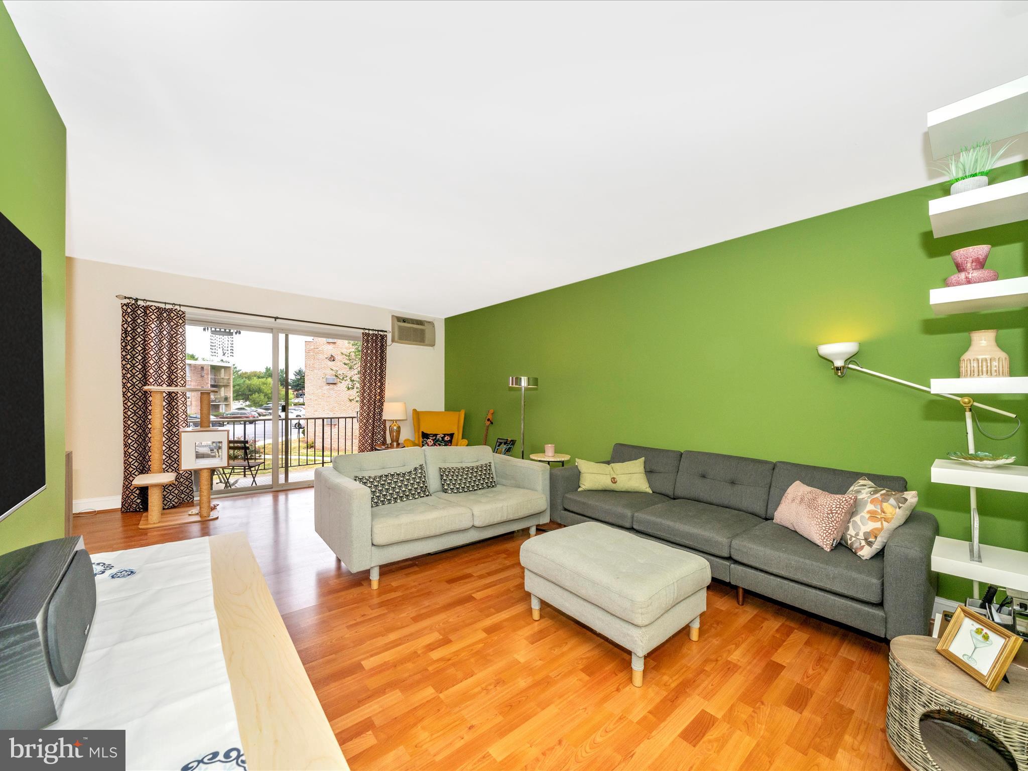 Welcome to this terrific, updated condo in the heart of Frederick. When you walk in to this vibrant space the first thing you'll notice is the light beaming from the wall of windows in the living room and dining room. The living room is spacious - with room for a seating/tv area as well as a space for a desk or reading nook. The dining room is large enough for a big table and open to the updated kitchen. Attractive and durable wood/laminate flooring throughout this living space! Step out on the balcony to enjoy the outdoors. A great place for morning coffee or to decompress in the evening. The kitchen has newer cabinetry and appliances, granite counters, full-size laundry, and tons of storage. As you move to the bedroom area you will notice a couple of closets for storing coats, the mechanicals, and linens. Both bedrooms are roomy, with new carpet, lots of light, and ample closet space. The wall unit air conditioners are efficient and quiet. Low condo fee includes water, sewer, fitness area, tot lot, and trash. Enjoy living in walking distance to restaurants, shops, groceries - plus easy access to all of Frederick's major commuter routes, public transportation. The convenience score is a 10, and the condo itself is an 11! Schedule your showing today!