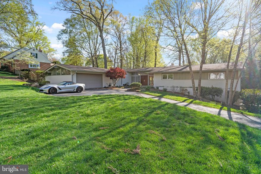 OFFER DEADLINE: MONDAY, 4/21, 3PM**!!   Move-In Ready in Chesterbrook Woods!
This absolutely stunning mid-century modern gem offers timeless style, thoughtful updates, and an ideal location. Featuring 5 bedrooms, 3 full baths, and 2 half baths, this home sits on a beautifully landscaped 0.52-acre lot in the highly sought-after Chesterbrook Woods community.
Recently refreshed with new interior paint, refinished hardwood floors throughout, a brand-new Miele dishwasher, a newer roof (approximately 5 years old), and replaced floor-to-ceiling rear-facing windows to enhance natural light and energy efficiency.
Inside, the home boasts dramatic floor-to-ceiling windows and doors, vaulted ceilings, and a bright, open layout. The gourmet kitchen is a chef’s dream—equipped with a Sub-Zero refrigerator, Wolf range, two Miele ovens, quartz countertops, an eat-in area, and a separate formal dining room. There are also two large pantries conveniently located near the breakfast area, just off the garage.
The elegant step-down living room features a striking fireplace and opens to a private deck and patio—perfect for seamless indoor-outdoor entertaining.
The luxurious primary suite includes vaulted and beamed ceilings, a generous walk-in closet, and sliding glass doors that lead to a private balcony overlooking the peaceful backyard. The spa-inspired en-suite bath features dual sinks, Cifial fixtures, a standalone soaking tub, a separate shower, and a private water closet.
The lower level offers a spacious recreation room with a fireplace, a cozy library, two additional spacious bedrooms, one full and one half bath, a large storage room, and a cedar closet.
Just one traffic light from Washington, DC, and conveniently close to downtown McLean and Tysons Corner, this turnkey home is located in the top-ranked McLean High School pyramid—offering sophisticated living in one of the area’s most prestigious neighborhoods.  **Note: The safe deposit box in the cedar closet, as well as the refrigerator and freezer in the garage, all convey with the property!**