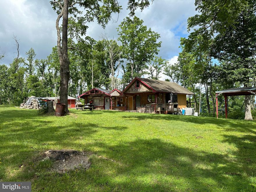 FINALLY FOUND IT......161 UNRESTRICTED ACRES WITH DIRECT FRONTAGE ON RT 50 FOR CONVENIENT ACCESS, YET TOTAL PRIVACY AND SECLUSION. SUPER COOL OFF GRID HUNTING CAMP ALLOWS YOU TO ENJOY THE PROPERTY FROM DAY 1 BUT THERE IS ELECTRICITY ALONG RT 50, ALLOWING YOU TO GET ON THE GRID IF YOU WANT AND BUILD YOUR WEEKEND RETREAT OR FOREVER HOME......MULTIPLE BUILDING SITES WITH JAW DROPPING WESTERN VIEWS! OUTSTANDING INTERNAL ROAD NETWORK PROVIDES MILES OF ATV TRAILS AND ACCESS TO THE MAJORITY OF THE PROPERTY. STREAM AND LARGE SPRING PROVIDE NATURAL WATER SOURCE.....INCREDIBLE HUNTING FOR ALL WV GAME, THE PROOF IS ON THE WALLS OF THE CABIN AND THERE'S 40 YEARS OF DOCUMENTED SUCCESS ON THE SKINNING SHED! SHOOTING RANGE ALREADY IN PLACE.....BLAZE AWAY AND PILE UP THE BRASS WITH NO WORRIES OF A COMPLAINING NEIGHBOR. PART OF PROPERTY WAS SELECTIVLEY TIMBERED A FEW YEARS AGO BUT IT WASN'T CUT HARD, STILL PLENTY OF LARGE STANDING TIMBER, THE CUT IMPROVED WILDLIFE HABITAT AND DOESN'T LOOK BAD AT ALL. THIS PROPERTY HAS SO MUCH TO OFFER AND COULD BE USED FOR SO MANY APPLICATIONS: HUNT, SHOOT, ATV'S, CAMP, BUILD, MEGA VIEWS, STREAM, SPRING, SECLUSION......ALL WITH DIRECT ACCESS TO RT 50, ONLY 25 MINUTES WEST OF WINCHESTER, VA AND ONLY 112 MILES FROM DOWNTOWN DC! IF WALLS COULD TALK......DECADES OF TALES ABOUT THE BIG ONE THAT GOT AWAY AND THE ONES THAT DIDN'T......THE NEXT SEVERAL DECADES COULD BE THE STORIES TOLD BY YOUR FAMILY AND FRIENDS....CREATE YOUR OWN LEGACY IN THE MOUNTAINS OF ALMOST HEAVEN!