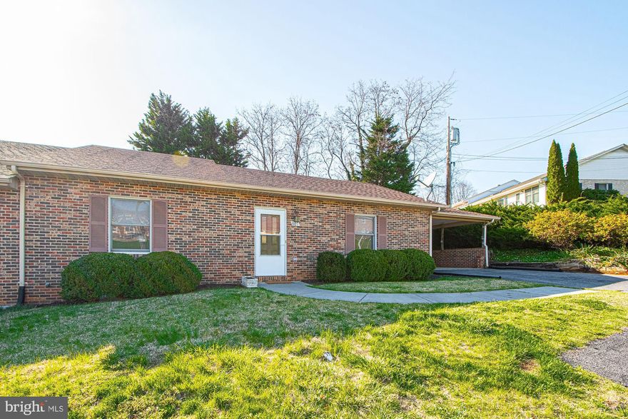 Welcome to easy living in this beautifully maintained 2-bedroom, 2-bath brick ranch-style duplex, nestled on a level lot that combines comfort, convenience, and charm—all at an affordable price.  Step inside to an open-concept great room that seamlessly blends living, dining, and kitchen spaces—perfect for entertaining or everyday living. The spacious master suite features a private bath with a walk-in shower and a skylight that fills the room with natural light and adjoins the main level laundry room. The second bedroom has a several closets and easy access to a hall bath with a tub/shower combo.  Enjoy a quiet neighborhood, a private backyard, ideal for relaxing or gardening, with easy access through the rear of the home. The attached 1-car carport, paved driveway, and additional paved parking pad provide ample space for guests and multiple vehicles.  Gutter Guards installed on rear of duplex, brand new Whirlpool dishwasher just installed in 2025 and new garbage installed in 2024. Located just minutes from Skyline Drive, the town dog park, and the convenience of two nearby shopping centers. Stroll down to the Main Street of town to explore charming local shops, restaurants, and bakeries that give Front Royal its unique, small-town appeal. Don’t miss this opportunity to own a comfortable, low-maintenance home in a sought-after location! Note:  that the real estate assessed value of $315,000 is for 2025 is based on the recent assessment and the approx.  real tax for 2025 is to be paid semi-annually (approx. $913 due June and $913 due Dec).