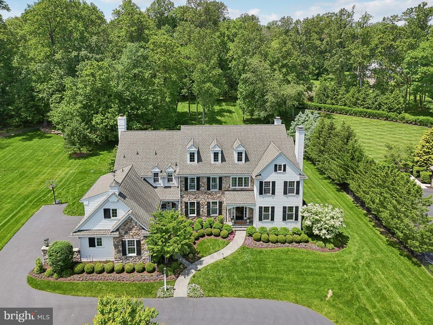 Welcome to 51 Farrier Lane in the uber desirable neighborhood of White Horse. Under the guidance of Meadowbank Designs, this luxurious 9000+ sqft, 6 bedroom, 6.2 bathroom home has been completely renovated and remodeled to the highest level of detail and attention. Sitting on just under 1.5 acres, this amazing property exudes curb appeal the second you enter the circular drive-way. Enter through the open foyer where elegant touches await with wall coverings, extensive millwork, built-in closets, bookcases and desks, and top-of-the-line light and plumbing fixtures. Formal spaces include a living room with gas fireplace, a dining room with attached butler’s pantry, and a professional office with gas fireplace and built-in bookcases. The chef’s kitchen with adjoining breakfast room offers custom inset cabinetry, island seating, commercial grade appliances, quartz counters, and mosaic backsplash. Directly off of the kitchen, the family room awaits with a coffered ceiling, gas fireplace, and plenty of windows offering a magnificent view of the grounds. The first level is completed with 2 powder rooms and a mudroom with built-in lockers and storage. The second level offers an exceptional primary suite with sitting room, two walk-in closets with built-in systems, and a newly refinished bathroom with dual vanities, soaking tub, and stall shower.  Four more ensuite bedrooms await with their own private bathrooms- 2 of which with built-in desks- and a laundry room, making life convenient. The finished third floor with separate zone is perfect for additional living space or storage. But the absolute showstopper is the finished lower level. Completed in 2021, this unbelievable space was given the Best of PA Living Awards by the Home Builders Association. This space offers a luxury lounge vibe with banquette seating and custom bar with inset cabinetry, marine finish walnut top, built-in dishwasher, microwave, fridge drawers, and wine fridge. The entertainment area and gaming space offer endless possibilities while the gym offers a sauna, yoga and work-out space. This level is completed with a 6th ensuite bedroom and bathroom. The exterior space is perfect for entertaining with a flagstone patio with freestanding fireplace and outdoor bar and kitchen. The expansive rear yard offers tons of space for play, sports, or a future pool. Walkable to Episcopal Academy with a private community path, minutes to downtown Wayne and Ellis Preserve, close to all major roadways for an easy commute to Philadelphia and Wilmington, and close to other private academies such as Agnes Irwin, The Haverford School, Academy of Notre Dame, and Malvern Prep. This property is truly one of a kind and is not to be missed- make your appointment today!