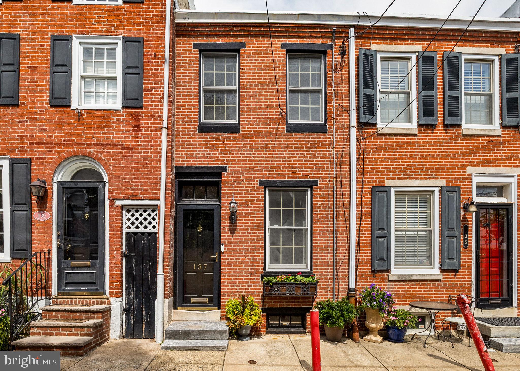 Discover this charming and inviting two-bedroom, one-bathroom Queen Village home nestled on the historic, quiet, tree-lined street of the 100 block of Monroe - known for its friendly neighbors and located in the award-winning Meredith School Catchment. This lovely home features a bright and airy interior, with south-facing windows that fill the space with natural sunlight throughout the day. The spacious eat-in kitchen is ideal for family gatherings and daily meals, making it a perfect place to create lasting memories. The home also boasts a small garden just off the kitchen, providing a tranquil outdoor space to relax, grill, or entertain. The home’s versatile layout and inviting ambiance make it ideal for its new steward to personalize and enjoy. Beautiful parks are located at the end of the street, providing easy access to outdoor recreation and scenic walks. The basement offers an opportunity for customization and additional living space, with a toilet and shower already installed. Whether you want to create a home office, personal gym, extra entertainment area, or a guest bedroom, this space provides excellent potential. Don’t miss the chance to own this meticulously maintained, Smart Home adapted, sun-filled, move-in-ready home in one of Queen Village’s most sought-after blocks.