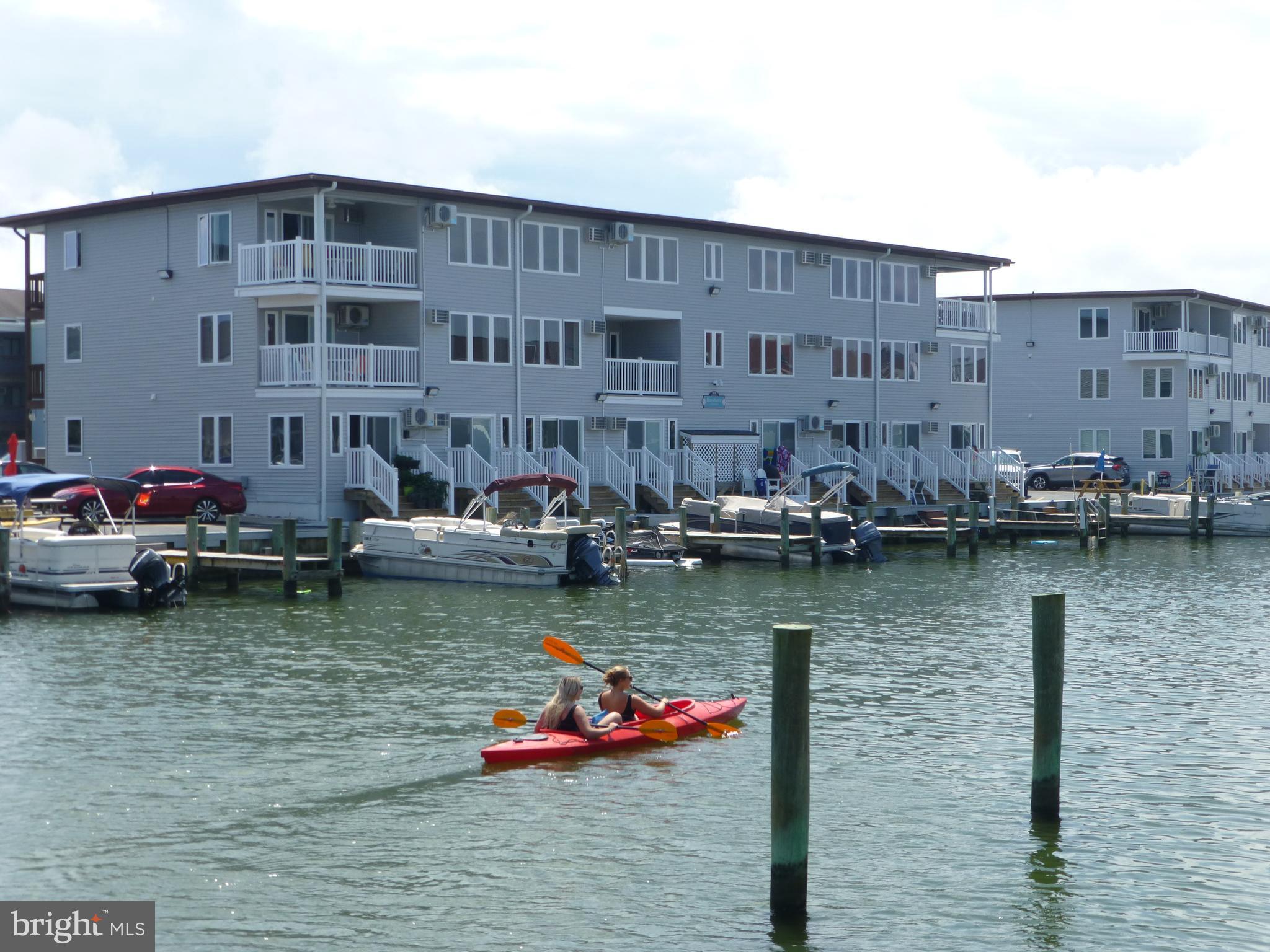 What an amazing value for a waterfront property. The building has been renovated with new siding, windows, and the decks and walkways repainted. Unit has a storage area on the walkway area. There is a new hvac heat/cool through the wall system. Excellent rental potential. Building has one of the few boat ramps in the area.