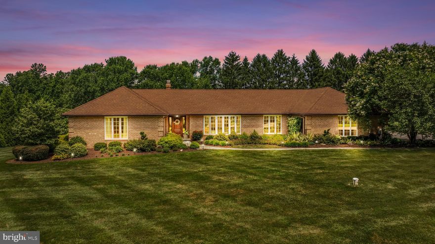 Tucked away on a picturesque enclave of Glen Arm, 4037 Holly Knoll Drive is a rare opportunity to own a refined retreat set on 1.24 impeccably landscaped acres. This extraordinary residence offers a seamless blend of luxury, comfort, and natural beauty—framed by mature trees, curated gardens, and a resort-inspired backyard oasis.

Step inside to discover a thoughtfully updated interior where every finish has been elevated to reflect the expectations of today's discerning buyer. Sunlit living spaces feature custom millwork, wood flooring, and thoughtfully designed living spaces, all designed with timeless appeal.

At the heart of the home, the chef’s kitchen impresses with top-tier appliances, quartz countertops, and custom cabinetry—perfect for entertaining or everyday living. A gracious living room with a fireplace and large bow window - the perfect spot for a respite after a long day.  A formal dining room for gatherings that flows into the kitchen for seamless entertaining.  A cozy family room with a fireplace for movie watching and a spacious bonus room with flexibility for multipurpose use.  

Main level spacious primary suite features hardwood flooring and a beautiful window for a flood of natural light.  The updated ensuite bathroom provides a spa experience featuring double sinks, custom cabinetry, quartz counters and an oversized glass enclosed shower.  Two additional well appointed bedrooms and updated bathroom adjacent from the primary suite are located in this central wing.  A fourth bedroom with an ensuite bathroom on the opposite wing perfect for guests or an in law suite.  Powder room is located between the Family Room and Bonus Room that are both ideal for entertaining.   The lower level features a recreational room, a cedar closet, and ample additional storage.  Enjoy the luxury of a four-car garage—perfect for accommodating vehicles, and recreational gear. Also includes a heated workshop and an additional half bath.

Outside, the grounds are nothing short of breathtaking. Unwind on the expansive covered patio, entertain under the stars within the courtyard with stately fountain, or take a dip in the sparkling saltwater pool surrounded by lush plantings and extensive hardscaping. Every corner of the landscape has been curated for privacy, serenity, and year-round beauty.  

Located just minutes from the conveniences of Towson and the charm of Jacksonville, Glen Arm is celebrated for its rolling hills, winding back roads, and an unmatched sense of peace—all while remaining conveniently connected to major commuter routes and top-tier schools.