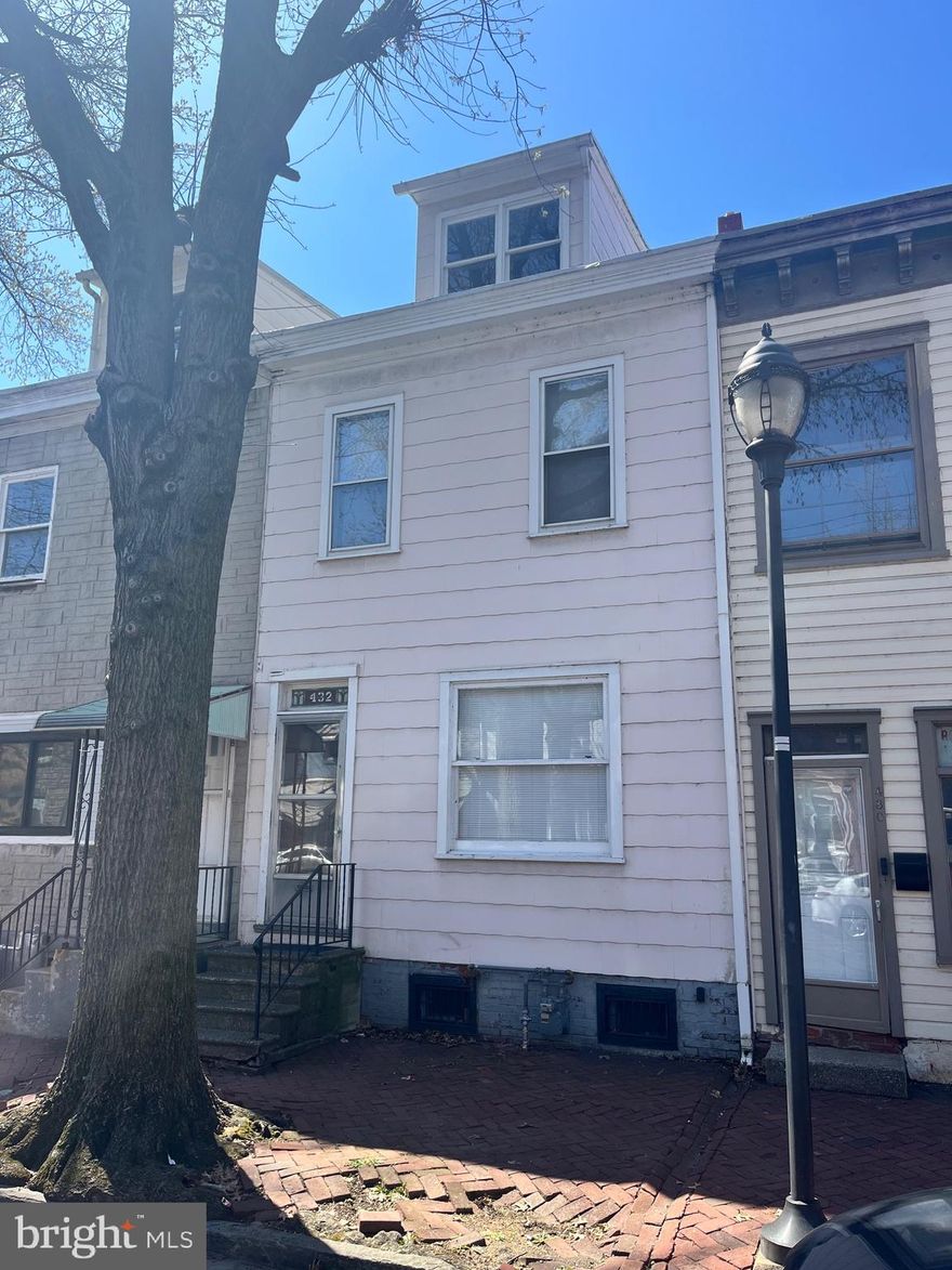 Let's take you back to 1957, you walk out your front door onto the hand laid brick sidewalk and tall glass globe street lamps,  to the sound of clanging from the tin roof repair shop next door, and the buzzing of excitement and rock and roll music coming from the ice cream parlor directly across the street. That is old Reading city charm, and that is exactly what 432 S 6th has to offer.  The home itself has been taken care of since the owners purchased it in 1972, and while no updating has occurred, the high ceilings, vintage porcelain kitchen, and oversized windows show that time has stood still, and time has been generous to this home. Shiny finished hard wood floors lay beneath a carpet that acted as protection all these years.  The 2nd floor has 3 bedrooms, and one full bath, with a third-floor attic, it is ready to hang dry wall and turn your 3 bedrooms into 4!!  The Kitchen leads to a backyard of green grass and beautiful landscaping, and also an oversized one car garage.  This home has gas heat and a metal roof, and bones so strong you think it drank milk every day!!  Please extend the life of this home by scheduling a tour and giving it decades more!!!