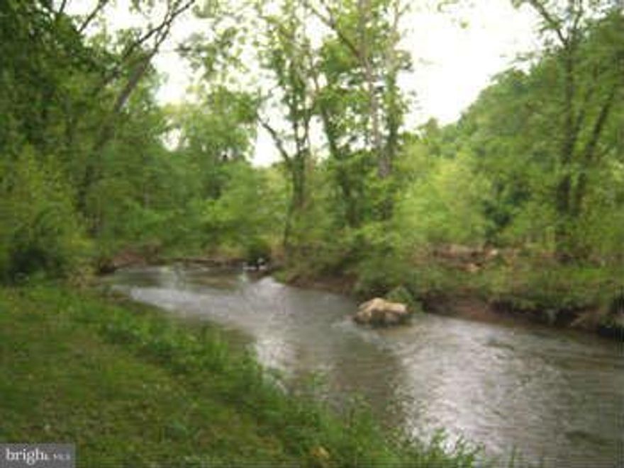 Cacapon River Access with a nice view! 6.57 acres, level building site along the west side of the Cacapon Mountain, small year long stream and mature hardwoods, older cabin shell and unused septic system considered of no value. The perfect place for that weekend cabin you've been dreaming about.