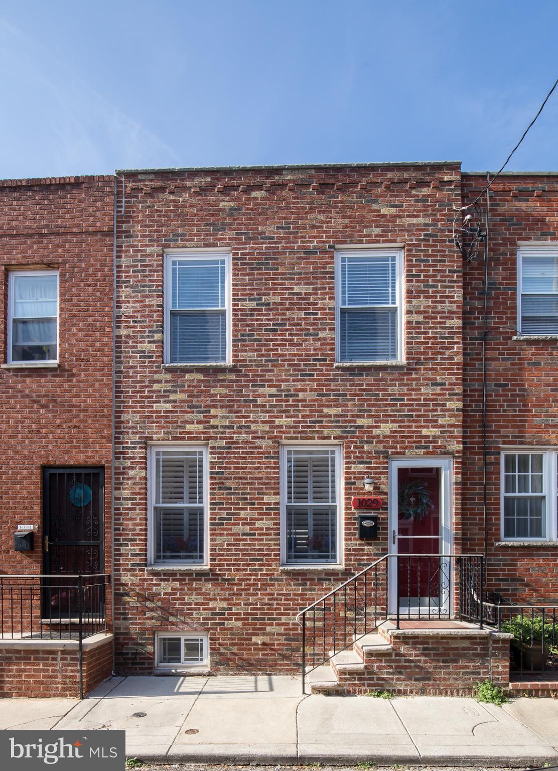 Fantastic opportunity to own a 2 bed, 1.5 bath home with a finished basement & central air in Passyunk Square.  Pristine and meticulously maintained, this home checks all the boxes with exposed brick, custom kitchen, large rear patio, tons of closet space, and conveniently located just a stone's throw from the heart of East Passyunk Ave.  Enter into the large open living room with high ceilings, hardwood floors, deep window sills, and a beautiful, exposed brick wall.  Beyond the dining area and convenient coat closet is a custom kitchen with granite counters, stainless appliances, tons of cabinet space, range hood & a large peninsula with stool seating.  There is also a bar area with more counter & cabinet space plus a built-in wine rack.  A sliding door leads to the large rear patio with seasonal planters ideal for a BBQ or entertaining family and friends.  Upstairs you will find a large front primary bedroom with high ceilings, tons of light, and an oversized closet.  The large rear 2nd bedroom is perfect for a home office or as a guest bedroom with its custom built-in Murphy bed.  The hall linen closet and bathroom with a large vanity and custom tub with tiles complete the 2nd level.  The finished basement with custom built-in shelving, powder room & laundry area does not disappoint and is perfect as a den, media room, gym, or home office.  This is truly a solid, well-built home that has been meticulously maintained by its owner.  It is easy to see yourself living here with the exposed brick, open floor plan, fantastic kitchen, great outdoor space, central air & finished basement.  Numerous upgrades including new HVAC in 2019, custom California closets in the basement, and the convenient, yet entertaining, Murphy bed in the 2nd bedroom.  A block from everything East Passyunk Ave. has to offer, around the corner from Mikes BBQ, a quick walk to the subway & easy access to Center City.  A special home that will not last.  Schedule your showing today!
