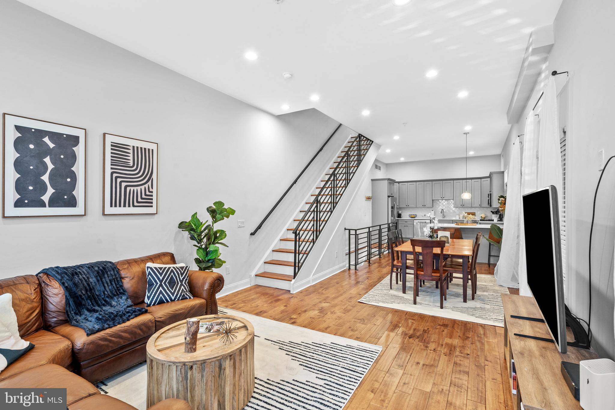 All showings to start at the Open House Thursday 8/14 from 530-730pm! Welcome to the best value in Port Richmond for 2025! This six-year-young home offers nearly 3,000 square feet of living space, a rooftop deck with skyline views, and the remainder of its 10 year tax abatement creating an exceptional opportunity you should not want to miss. Experience refined city living in this stunning 3 bedroom, 3 full-bath townhome spanning four beautifully designed floors. Upon entering the open floor plan you’ll find an abundance of natural light showcasing pristine hardwood flooring with sweeping 12ft ceilings. A seamless transition into the kitchen/dining area offers an exquisite design, intentionally laid out to comfortably entertain while keeping the coziness of everyday gathering in mind. The second floor boasts two sizable bedrooms, ample closet spaces & is complete with laundry units and a full modern bathroom. The third floor features a master suite complimented by an oversized, upgraded full bathroom allowing for both privacy & accessibility. Ambiance and endless panoramic views of the Philadelphia skyline await from the rarely offered rooftop terrace - perfect for enjoying morning coffee in peace, evening relaxation, or added entertainment space. Coupled with a fully finished basement, additional highlights of this home include energy-efficient systems (HVAC replaced in 2024) and ample parking availability. Insulated by surrounding new construction, this home makes for the best value offered in Port Richmond of 2025 with 4 years remaining on the tax abetment of this property. Accessible to I95 and steps away from Pizza Richmond, Tacconelli’s, Stock’s Bakery, Marinucci’s Deli & everything else that Port Richmond/Fishtown notoriously has to offer - this home is poised to deliver the convenience & lifestyle you’ve been searching for.