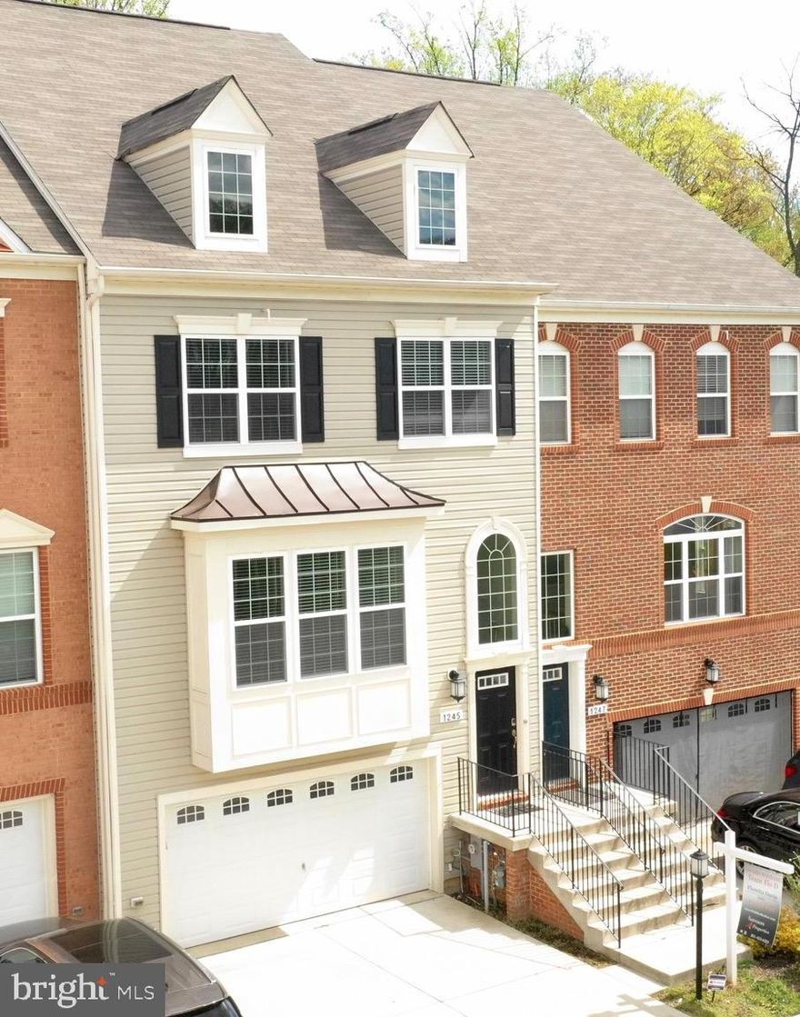 ABSOLUTELY BREATHTAKING LENNAR ARLINGTON MODEL TOWNHOME IN THE SOUGHT-AFTER COMMUNITY OF SUMMERFIELD VILLAGE. ONLY 4 YEARS YOUNG BOASTING OVER 3600 TOTAL SQUARE FEET WITH 4 LEVELS OF LIVING SPACE, 9 FOOT CEILINGS, OPEN DOUBLE STORY FOYER, MAIN  LEVEL OPEN FLOOR-PLAN W/ SEPARATE LIVING AND DINING ROOM, GOURMET GALLEY STYLE KITCHEN, STAINLESS APPLIANCES, WALL OVEN & MICROWAVE, BEAUTIFUL GRANITE, DARK WOOD 42' CABINETS, AN OVERSIZED ISLAND GREAT FOR ENTERTAINING, MAIN LEVEL FEATURES HARD SURFACED FLOORING, A SLIDING DOOR TO ACCESS THE LOW MAINTENANCE DECK, WALKOUT BASEMENT W/ WALL TO WALL CARPET, SPACIOUS REC ROOM, UTILITY ROOM, PRIVACY FENCED YARD, UPPER LEVEL OFFERS 3 BEDS, LARGE OPEN MASTER SUITE W/ SITTING AREA WITH WALK-IN CLOSET SYSTEM, MASTER BATH W/ DOUBLE VANITY, DOUBLE HEAD SHOWER WITH BENCH, 4TH LEVEL....THE LOFT THAT FEATURES A HALF BATH,A WET/DRY BAR W/ A WINE FRIDGE (GREAT AS A GAME ROOM, MAN CAVE, OFFICE, STUDY OR PLAYROOM).... FRENCH DOOR THAT LEADS TO THE UPPER-LEVEL TERRACE WITH TURF FLOORING (ENJOY A NICE EVENING UNDER THE STARS)... COMMUNITY HAS A WALKING TRAIL, CLUBHOUSE, DOG PARK AND A TOT LOT!! THIS HOME & COMMUNITY HAS SO MUCH TO OFFER & CONVENIENTLY LOCATED TO SHOPPING, RESTAURANTS, BWI, MINUTES FROM ROUTE 50 AND 97.