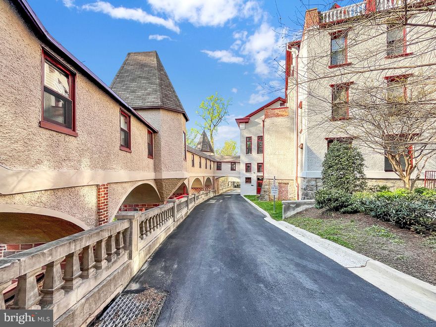 $5000 closing credit! Charming, Spacious, and One-of-a-Kind Historic Condo in the Music Hall Building – This exceptional 2-level condo in the historic National Park Seminary offers a rare opportunity to live in a piece of history. Originally established in the late 19th century as a resort hotel, the National Park Seminary became a school for young women before transitioning into a U.S. Army facility during World War II. After the campus was decommissioned in 2004, it was meticulously redeveloped over the past decade, preserving its architectural grandeur while blending modern comforts.

Every room in this unique condo is filled with character and charm. From the impressive second-floor turret, complete with a private staircase and soaring ceilings, to the sun-drenched living spaces offering breathtaking tree-top views, this property truly stands out. The main floor features a primary suite nestled in the building’s iconic rounded turrets, where you can enjoy panoramic views through a curved wall of windows. The second bedroom, inspired by European design, boasts a large walk-in closet and elegant architectural details.

This condo is ideal for those who appreciate craftsmanship, historic charm, and timeless beauty. As part of the National Park Seminary, the property offers an opportunity to live in a historically significant building with all the modern amenities one could desire. The dog-friendly building includes a deeded garage parking space and is nestled in a community brimming with architectural interest. It’s also perfectly located, just minutes from two metro stations (Forest Glen and Silver Spring), Rock Creek Park, and a vibrant neighborhood filled with shops, dining, and outdoor recreation.

Enjoy the outdoors from your private terrace, perched like a treehouse above the serene glen, and take advantage of extra storage in the eaves. Additionally, buyers can benefit from a significant historic tax rebate after settlement, a bonus provided by the Maryland Historic Trust.

Key Features:

3BR/2BA, den, other spaces including a turret, 2-level condo with 22 ft ceilings, 3400+ sq. ft. of living space.

Open floor plan with hardwood floors, custom closet systems, and abundant natural light.

Light-filled and spacious and gracious, 2 car attached garage and ample guest parking

Private terrace with scenic views, ideal for outdoor relaxation.

Community amenities include a fitness room, a grand ballroom, and social spaces.

Pet-friendly and part of a vibrant historic neighborhood.

Easy access to bike/walking trails, Rock Creek Park, and two metro stations.

Minutes from downtown DC, Chevy Chase, and the Capital Beltway.

Historic Legacy: The National Park Seminary is a place of rich history, from its roots as a luxury resort to its transformation into a renowned women’s school, and later, a military facility during wartime. The property’s careful restoration preserved the architectural beauty of the original buildings while offering modern living spaces. This condo allows you to be part of that history, living in a space that reflects both the past and the present.

Don’t miss out on this opportunity to own a truly unique and historic home in one of the most charming settings in the area.