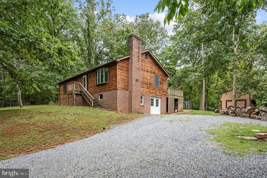 This handsome Rancher is nestled in a bend of the Shenandoah River,  on a partially wooded 5 acre lot just minutes from Route 7 and commuter points both east and west.  Oversized windows in large living room offer stunning views of expansive yard and surrounding private woodlands. Contemporary  eat-in Kitchen enjoys access to substantial two-level deck and inviting back yard. Full, level walk-out basement.