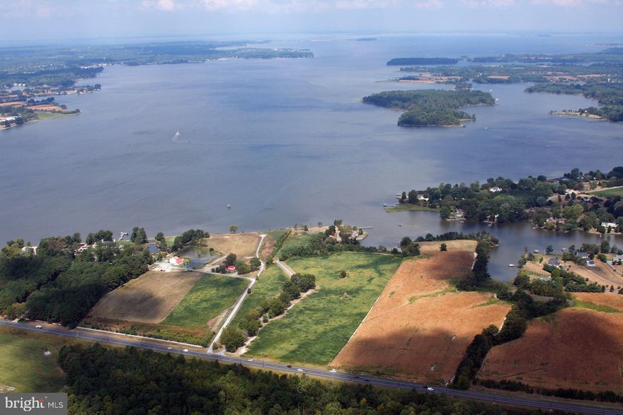 "Newcomb Hall Farm" fifty acres of woods, field, and outstanding homesite commanding superlative water views. Sunrises and sunsets over the water.  Vast river views to the northwest, quiet creek views to the east. Newcomb Creek is a famous resting place for waterfowl and provides entertainment watching the many ducks and geese who shelter in the cove.  Crabbing, fishing, swimming, boating. The location is minutes from Easton (County seat of Talbot County, with  airport, courthouse, hospital, great restaurants, art galleries, museums etc.) and St. Michaels (a port dating to the 17th Century, now home to the Chesapeake Bay Maritime Museum, restaurants,  lively nightlife, and shopping). Unshared tree-lined driveway. Boat dock. Extensive engineering has been done and recorded, to allow construction of a substantial new residence overlooking the river. Present house is charming and comfortable, but is being sold "AS IS WITHOUT REPAIRS". Choptank Electric. Shown by appointment only.