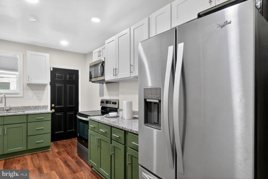 Welcome to 1246 Washington Boulevard, a fully renovated Pigtown townhouse offering style, functionality, and unbeatable access to Baltimore’s most iconic destinations. With major upgrades already completed—including floors, HVAC, hot water heater, and modern finishes throughout—this home is truly move-in ready.

The open-concept main level is designed for seamless living and entertaining, anchored by a stylish kitchen with stainless steel appliances, quartz countertops, and generous cabinet space. The main level also includes a convenient half bath, along with striking exposed brick that adds warmth and authenticity throughout. Upstairs, you’ll find two spacious primary bedrooms each with en-suite bathrooms, offering flexibility for guests, roommates, or a home office setup. In the lower level you’ll find a third bedroom and private full bath.

Step outside to a private rear courtyard—perfect for morning coffee, intimate gatherings, or unwinding after a long day. Situated in the heart of Pigtown, this home is just minutes from Carroll Park (3 minute walk), Oriole Park at Camden Yards, M&T Bank Stadium, Baltimore Museum of Art, the University of Maryland Medical Center & the University of Maryland School of Dentistry, Downtown Baltimore, and major commuter routes, with BWI Airport only 15 minutes away.

A turnkey opportunity in one of the city’s most connected neighborhoods—this is Pigtown living at its best. Schedule your private showing today!